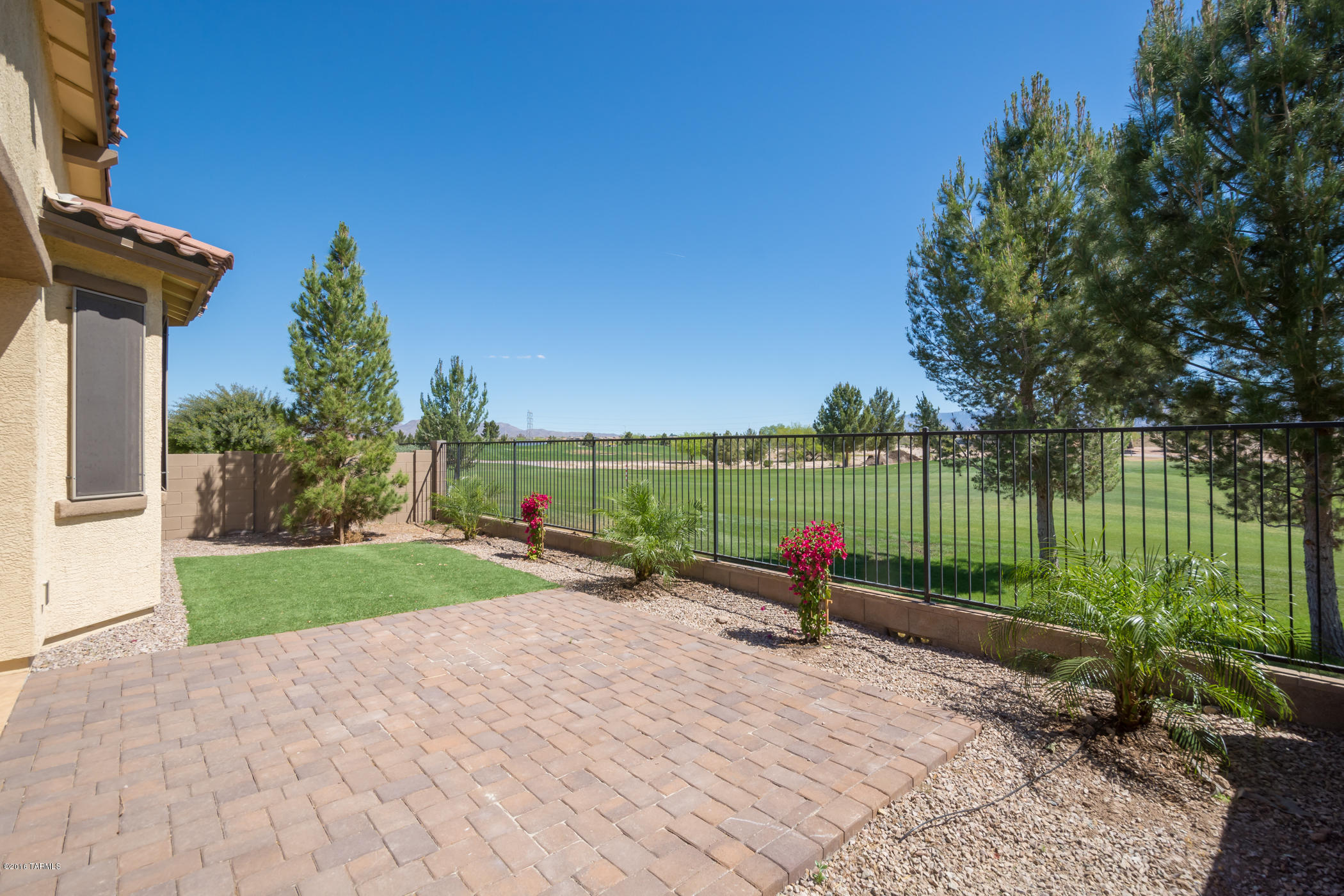 LISTED BELOW APPRAISED VALUE! Immaculate and freshly painted, this golf course Pines II gated community home is ready for move in! Beautiful updated kitchen includes granite, new tile back splash, gourmet stainless steel appliance package with double ovens. With a split floor plan the spacious master bedroom has incredible views of the golf course and mountains. The master bath includes shower, soaking tub, and executive height sinks. Tile dresses up the front entryway as well as in the back under the covered patio. Brick pavers extend the entertaining area out back to enjoy the golf course and mountain views. Enjoy the community pool on hot summer days, let the kids play on the community playground, or enjoy a round of golf at the Pines Golf Course. Upgrades-over 17K-in documents section.