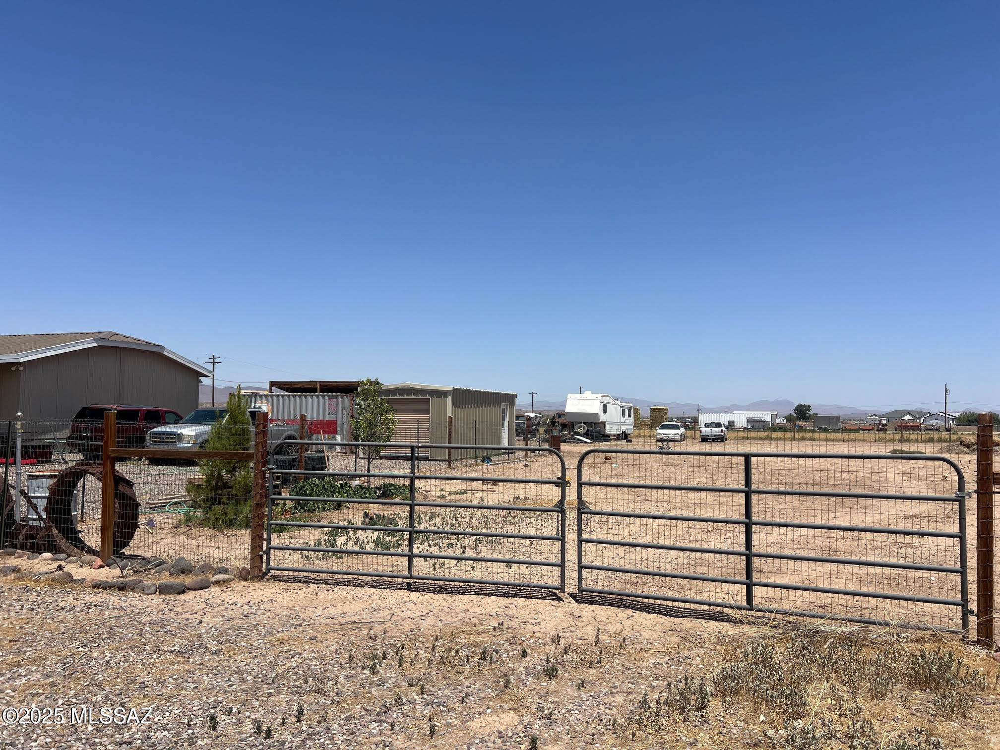 This is a beautiful flat acre plus just waiting for a site built of manufactured home!  Great views of the mountains - quiet neigborhood with room to sperad out a little- Come take a look at this awesome parcel!