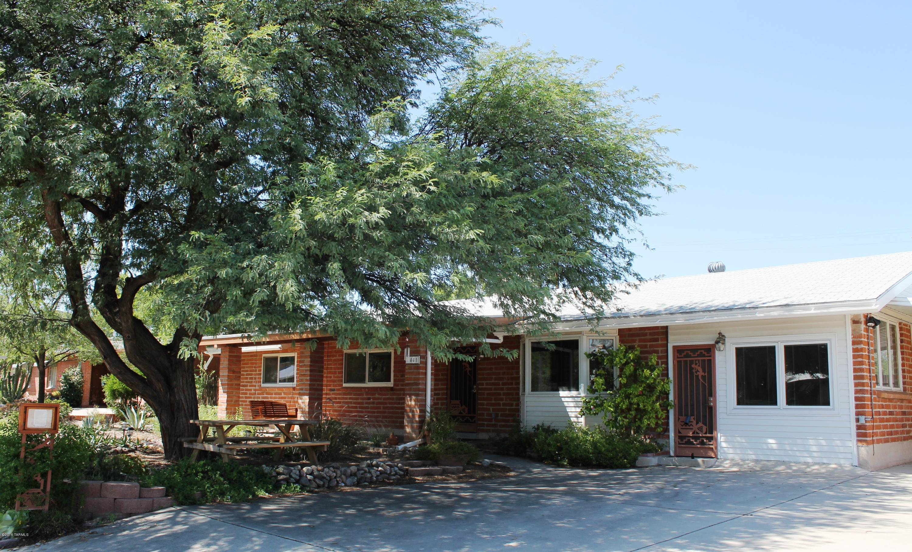 Perfectly Charming Burnt Adobe Home with Guest Quarters in Great Central Neighborhood. Over 1,900 SQ FT with 4 Bedrooms, 3 Baths & Open Floor plan! Custom Low VOC Interior Paint. Triple Pane Pella Windows & Doors. Newer Refrigerator, Washer & Dryer. New Tile Flooring in Bedrooms. Guest Quarters has Separate Entry from Carport. Ideal for Friends, Family or Rental. Outside Features Huge Covered Porch with Bench Swing & Picnic Table, Fruit & Vegetable Garden, Passive Rainwater System, Drought Tolerant Landscaping, Gray Water Line, Mature Trees, Small Grass Area & Firepit. Large Lot Size 9,430 SQ FT Has Storage Shed & Wide Gate To Alley. Must See Soon to Appreciate All the Upgrades & Details.