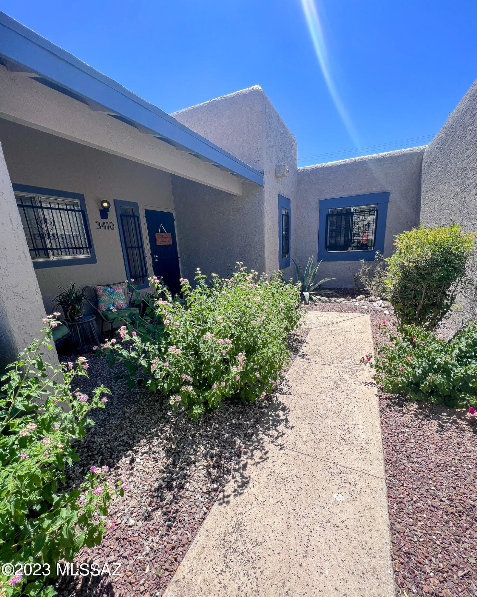 Move in ready updated 2 bedroom 2 bath in the desirable Richland Heights Townhomes! Close to UofA, Banner, St. Phillip's Plaza, La Encantada Shopping Mall, and more!  Living room features vaulted ceilings, fireplace, and sliding doors that lead to the private and lush backyard. Kitchen features custom wood countertops and subway tile backsplash. Primary suite has private access to backyard seating area surrounded by mature vegetation. Laundry room with extra storage and utility sink hook up. HVAC was replaced in 2020. Fresh exterior and interior paint in 2023. Community pool and spa. Covered parking. HOA pays water. Don't wait, this charming home won't last long!