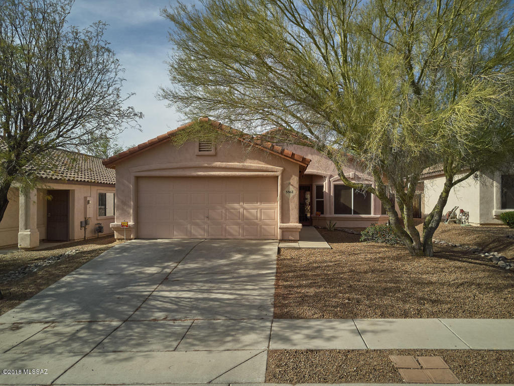 This warm and welcoming Dove Mountain home has so much to offer. The bright kitchen has a gas range, breakfast bar and plenty of counter space. Home also features sunscreens, ceiling fans and neutral colors. Large master bath has garden tub and separate shower. Inviting, easy care backyard with covered patio and citrus trees. Move in ready and lovingly cared for. Affordable, comfortable, and convenient. A great place to call home!