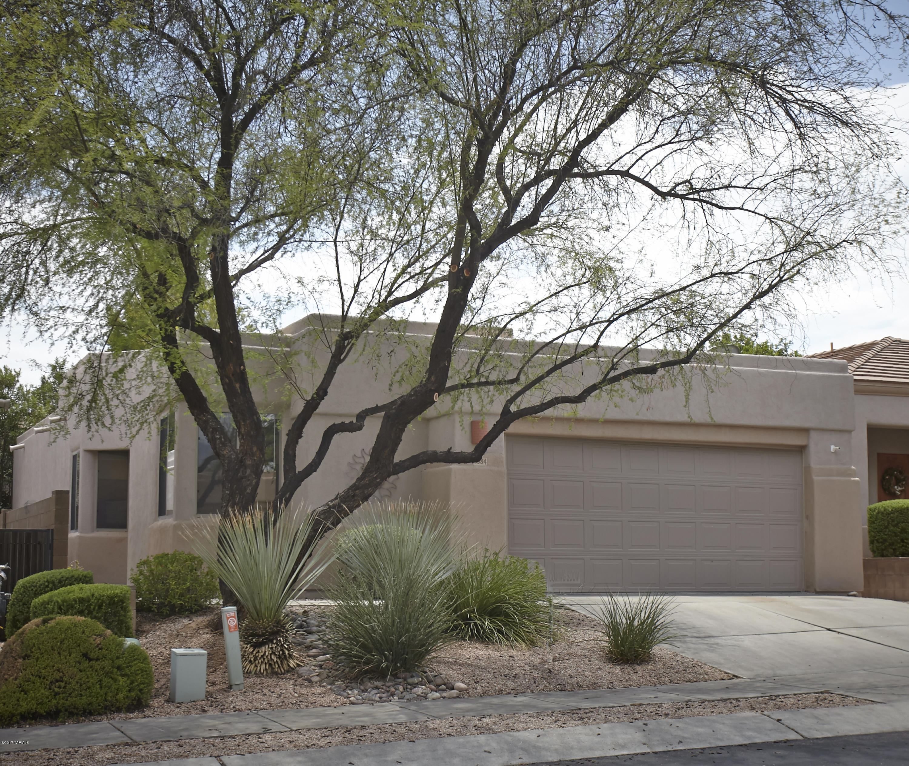 Seller says, ''bring an offer!'' Like New in Desirable NE Gated Community. This home has New Carpet and it was Just Painted so it's nice and fresh! Work from home in Bedroom #2 as home office overlooking the Catalina Mountains!  Light, bright high ceilings, larger master bedroom with split floor plan. Eat in kitchen with breakfast bar. Very close to Community Pool & Spa, Udall Park and great shopping. Flagstone patio for backyard entertaining.Energy efficient Home Certified by SW Gas.  Built by Award Winning AF Sterling.