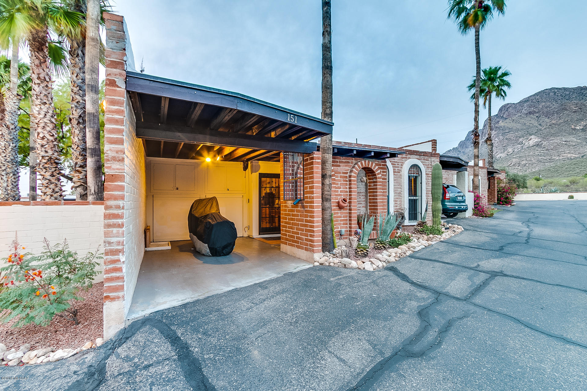 Super cute Oro Valley townhome! Move in ready home tastefully updated and gorgeous. Remodeled bathrooms feature executive height hickory vanities. This home has it's own gate directly into the pool area. Open floor plan features bee hive fireplace, neutral flooring and wood accents and trim around doorways. SMALL TOWNHOUSE COMMUNITY, ONLY 28 UNITS. THIS 2BR/2BA SOUTHWESTERN ADOBE HAS BEEN COMPLETELY REDONE. H.O.A. INCLUDES COMMUNITY POOL, TRASH PICKUP AND HAZARD INSURANCE.