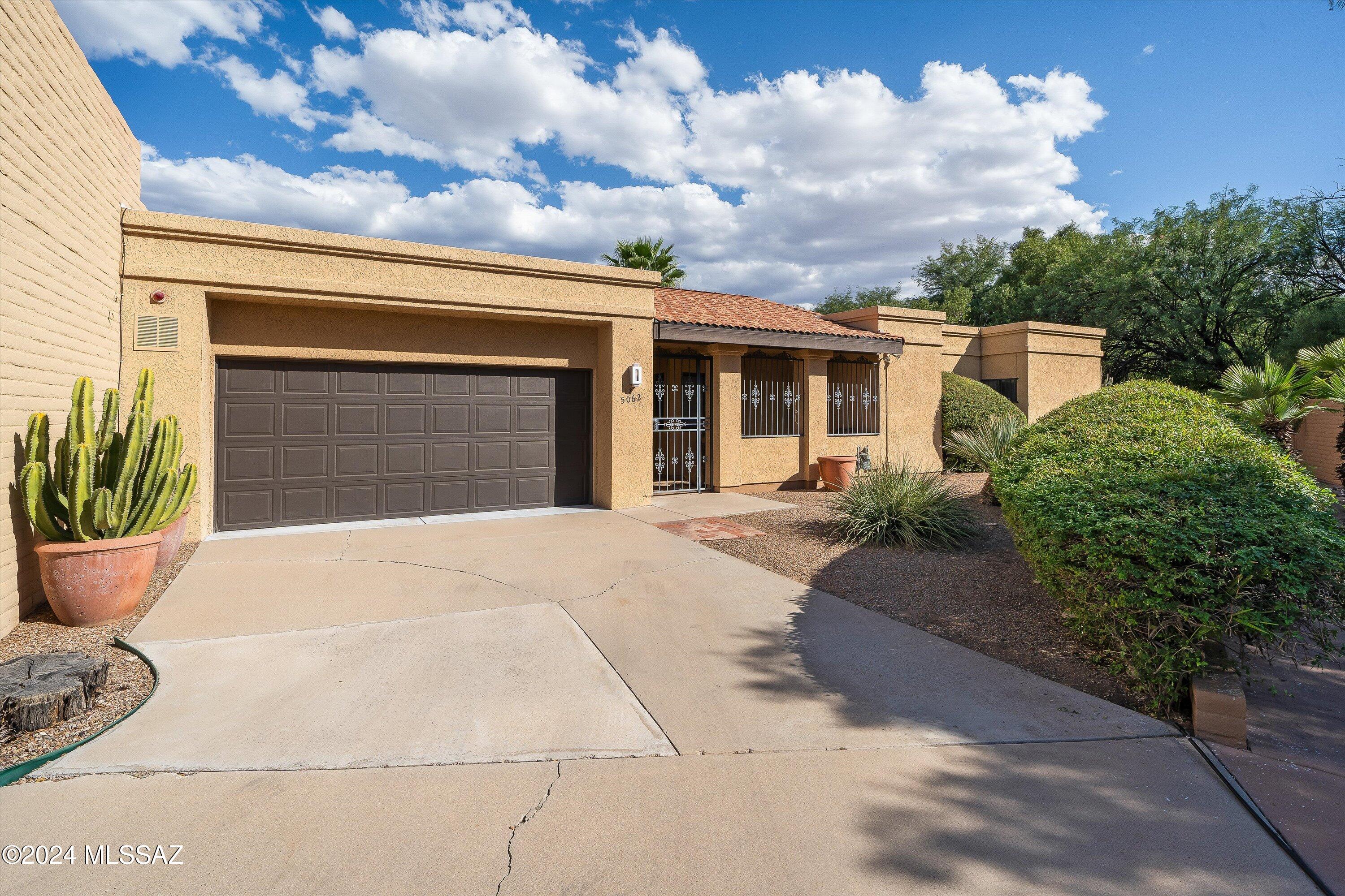 Welcome to this stunning 2,300+ sq ft townhome nestled in the highly desirable Rosemont Regency subdivision, right in the heart of Tucson! This well-maintained home features a spacious and functional layout, including three bedrooms and two bathrooms, plus an additional bedroom and bathroom with a private entrance—offering a versatile space ideal for guests, a home office, a workout room, or a secluded retreat. Entertain with ease in the large living room that opens to the tranquil backyard, complete with a wet bar, making it the perfect setting for gatherings and relaxation alike. The kitchen is fully equipped, with all appliances included, ensuring a smooth transition to your new home.
The home boasts a newly recoated roof (October 2024) and a serene outdoor space, ideal for unwinding amidst Tucson's desert beauty. With a 2-car garage and thoughtfully designed interiors, every inch of this home is crafted for comfort and functionality. Enjoy all the benefits that Rosemont Regency HOA offers, including a sparkling community pool, hot tub, beautifully maintained streets, and front yard care. This western oasis is conveniently located near popular shopping and dining destinations, blending the best of city life with the peace of a quiet retreat. Don't miss your chance to make this Tucson treasure yours today!
