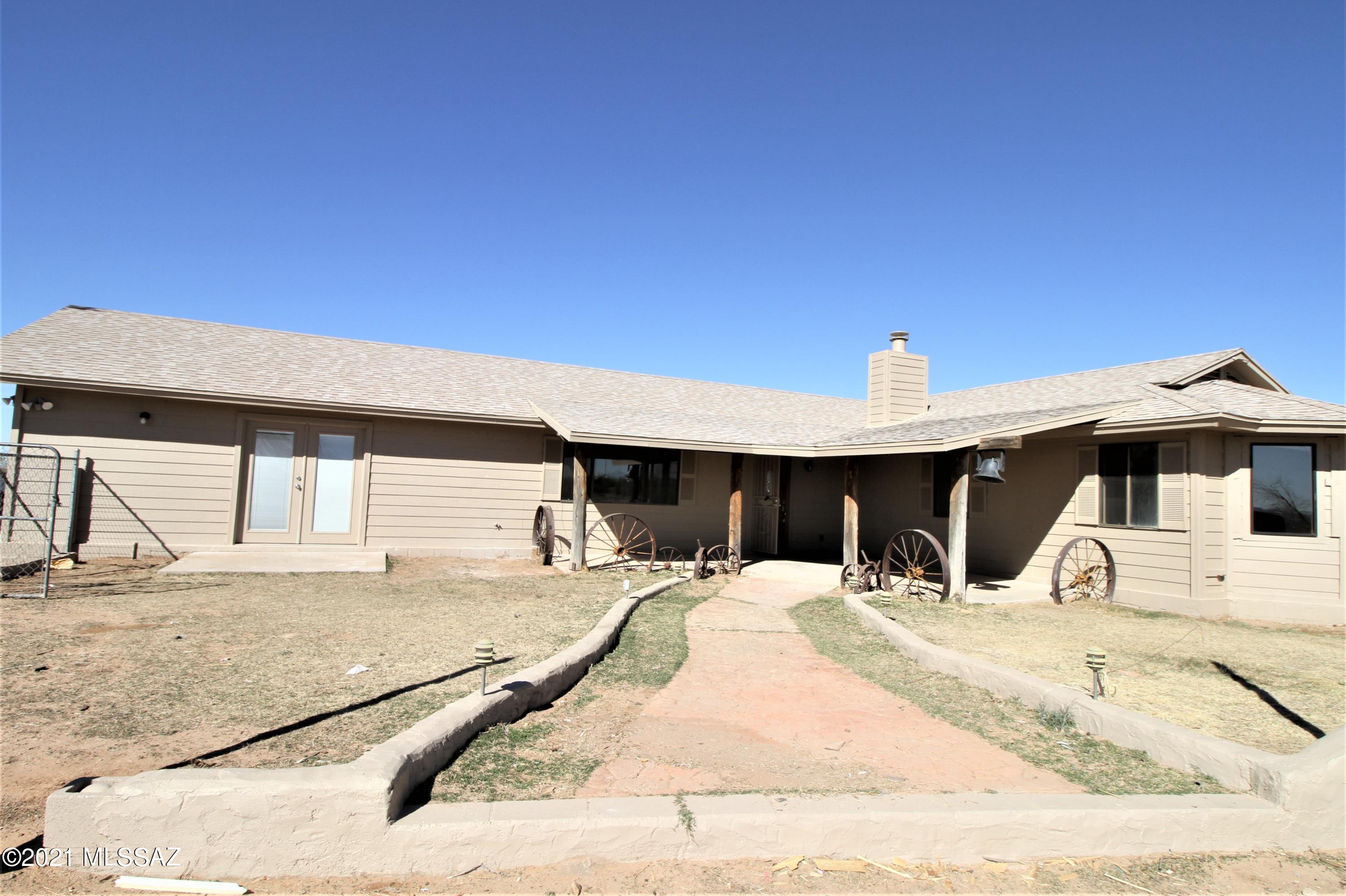 Range price marketing - Seller will consider offers from $260,000 to $280,000. Not a mobile home on 5 acres! Plenty of room to grow in this 5 acre parcel located in the heart of Marana. This home has been updated with new roof, new HVAC, new paint inside and out, new flooring, new well system,  new bathrooms and much more. This home also enjoys a large game room incorporated as part of the main house. This is an opportunity  to own a unique single family home on 5 acres that won't last.