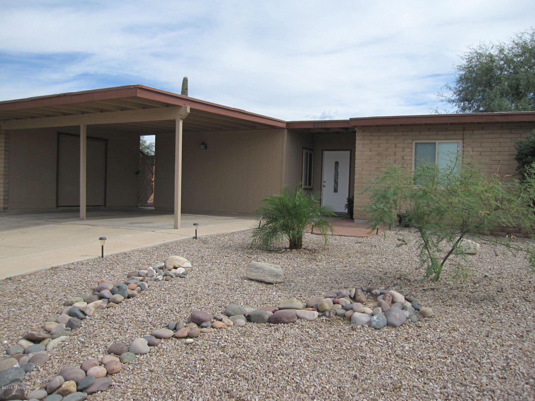 This little gem is waiting for you. New A/C, 1-yr old water heater, granite counters, stainless steel appliances, upgraded kitchen cabs, bright & roomy kitchen, 16x16 ceramic tile through out home, upgraded doors & windows and upgraded bathroom counters/lights & fixtures. Enjoy entertaining or just relaxing on your private covered patio with a large & private back yard. Storage shed in back yard conveys ''as is'' plus there is a large storage area in the 2-car carport. The community park with lighted basketball courts, jogging path and baseball diamond is right around the corner. You are less than 5-min to I-10, shopping, Canada de Oro bike path, banks and markets. This home has everything including location, location.