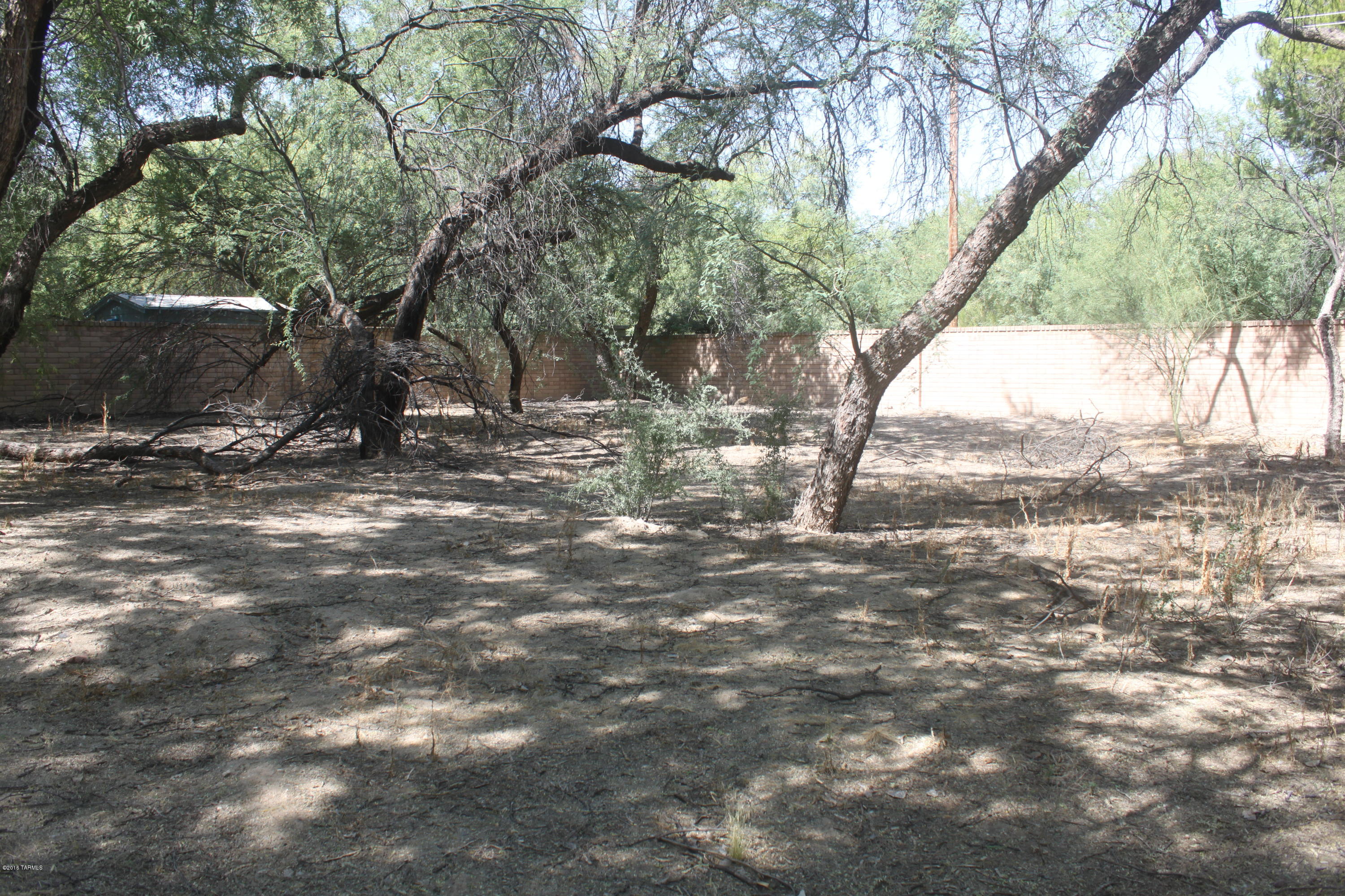 Wonderful place to Build Your Home on a Secluded Country Lane in a Cozy Private Estate Community.  Secluded Enclave of JUST 20 LOTS- Located in a Mesquite Bosque - Adjacent to the Popular
River Walk at the confluence of the Tanque Verde Creek and Sabino Creek which provides a much sought after Refreshing Riparian Environment.