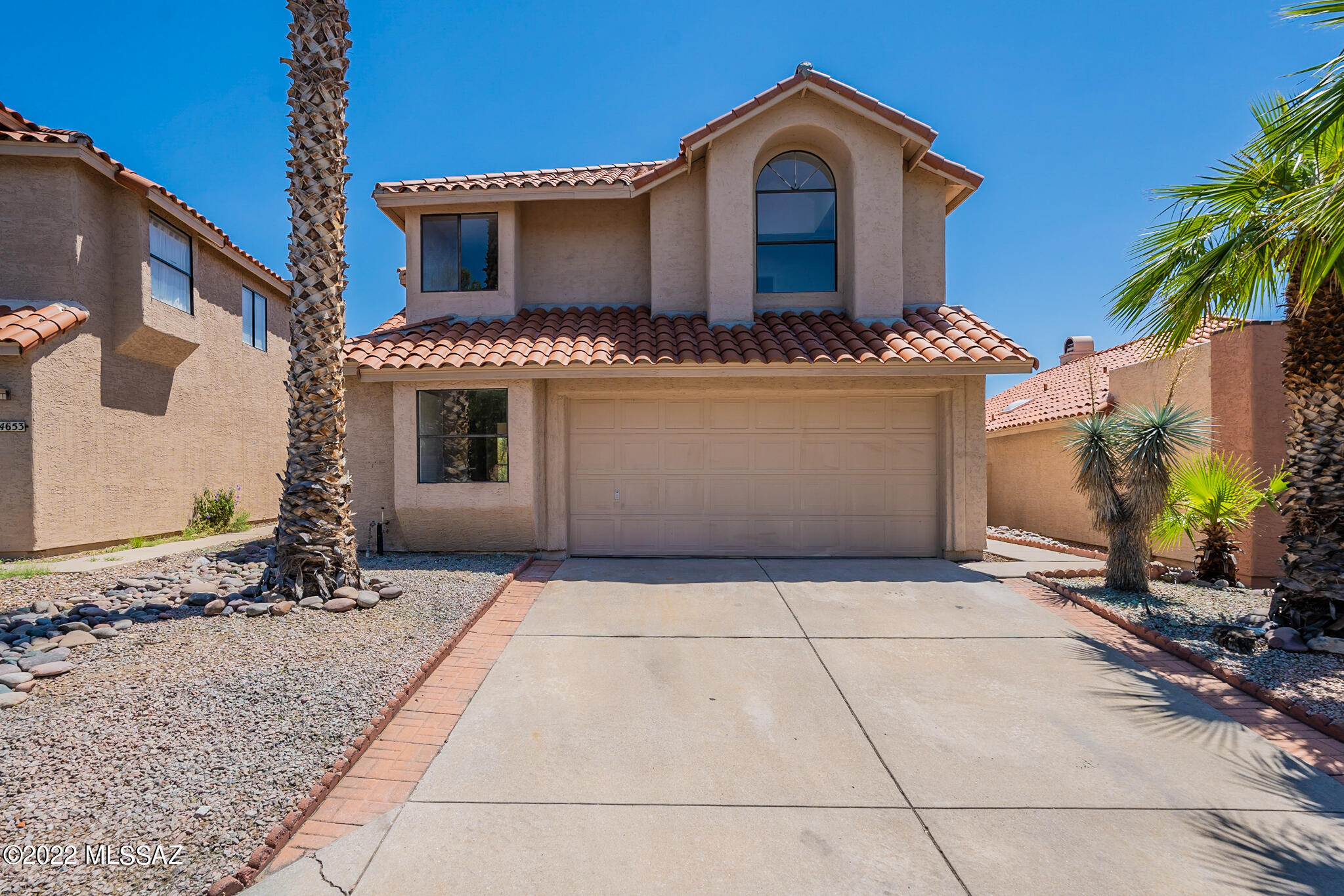 Welcome to this gorgeous neighborhood! Don't miss this professionally renovated home backing beautiful desert land. This kitchen is ready for cooking with new granite counters, stainless appliances, tile backsplash and ample refinished cabinets for storage. Flow into the main living area, featuring a cozy fireplace. The primary bathroom features a separate tub and new custom tile shower along with dual sinks. Interior paint is fresh and floors are new.  Head to the backyard for the perfect private area to enjoy the outdoors. Roof underlayment was completely replaced to give years of worry free living.  Don't miss this incredible opportunity.