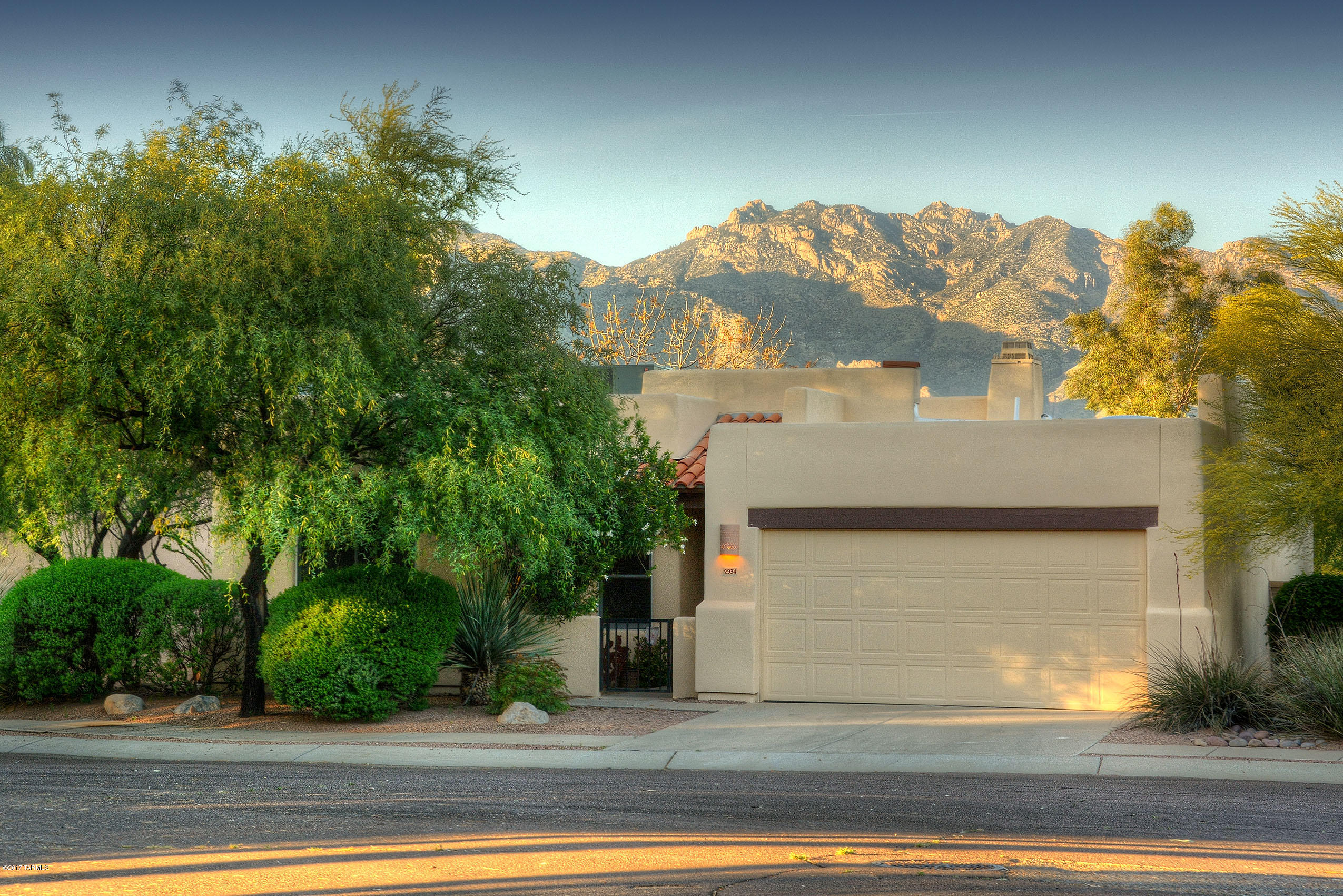 Fabulous Catalina Mountain Views from both inside and out of this charming home nestled in the small enclave of Rancho Alamo in the Historic Ft Lowell district.  Wonderful open floorplan features a greatroom with a cozy fireplace,  polished concrete floors, dining area and lovely open kitchen with a gas range, colorful tile backsplash and lots of counter space. All new Anderson windows.  Private bkyd offers a covered patio, brick pavers, mature landscaping and of course those views! Mstr Ste features slider to the outdoors, walk in closet and dual vanities. Two additional bedrooms and a full guest bath round out this special home.  Fresh paint inside and out of this extremely well maintained home.  Amazing location convenient to Riverwalk, TMC, Plaza Palomino and great shopping and dini