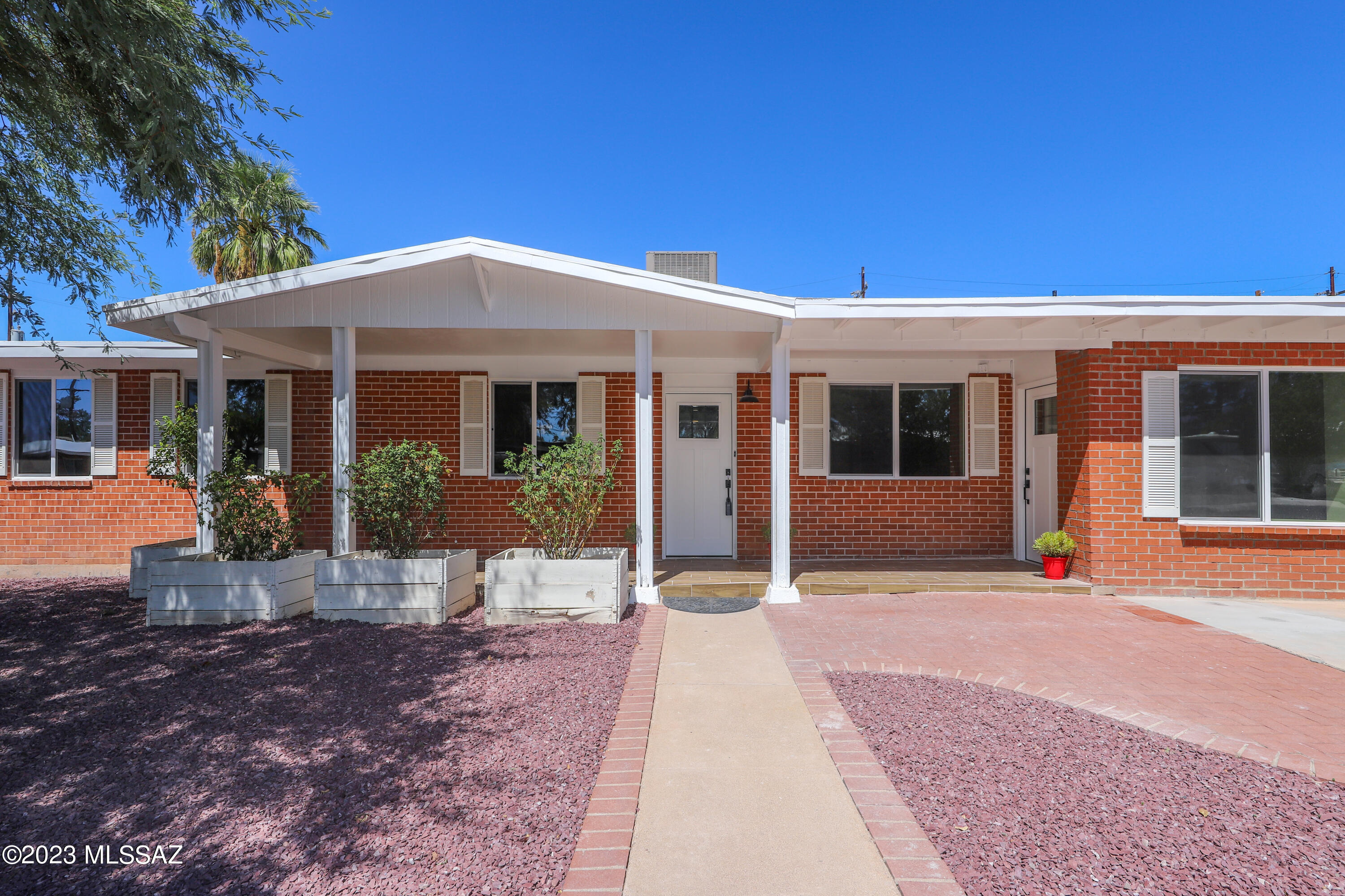 Step into luxury with this recently renovated 3-bed, 2-bath home featuring a separate guest quarters and a unique 200 sq. ft. bonus room complete with heating, cooling providing a flexible space for work, play, or relaxation. The main residence boasts an open-concept layout with a chef-inspired kitchen, master suite, and versatile additional bedrooms. The guest quarters offer a private retreat with its own bedroom, bathroom, and living/kitchenette area.  Imagine curling up by the fireplace with a good book in hand, or hosting intimate gatherings with friends and family in this inviting space.  Each room exudes a sense of modern luxury and comfort.  The outdoor oasis features a recently updated pool and landscaped yard. Conveniently located near amenities, this home offers a perfect blend of style, functionality, and outdoor allure. With its unique features and layout, this property presents an excellent rental or investment opportunity. The seller eagerly awaits your offer, ready to turn your dreams into reality. Don't miss the chance to experience refined living - schedule a showing today! Owner/Agent.