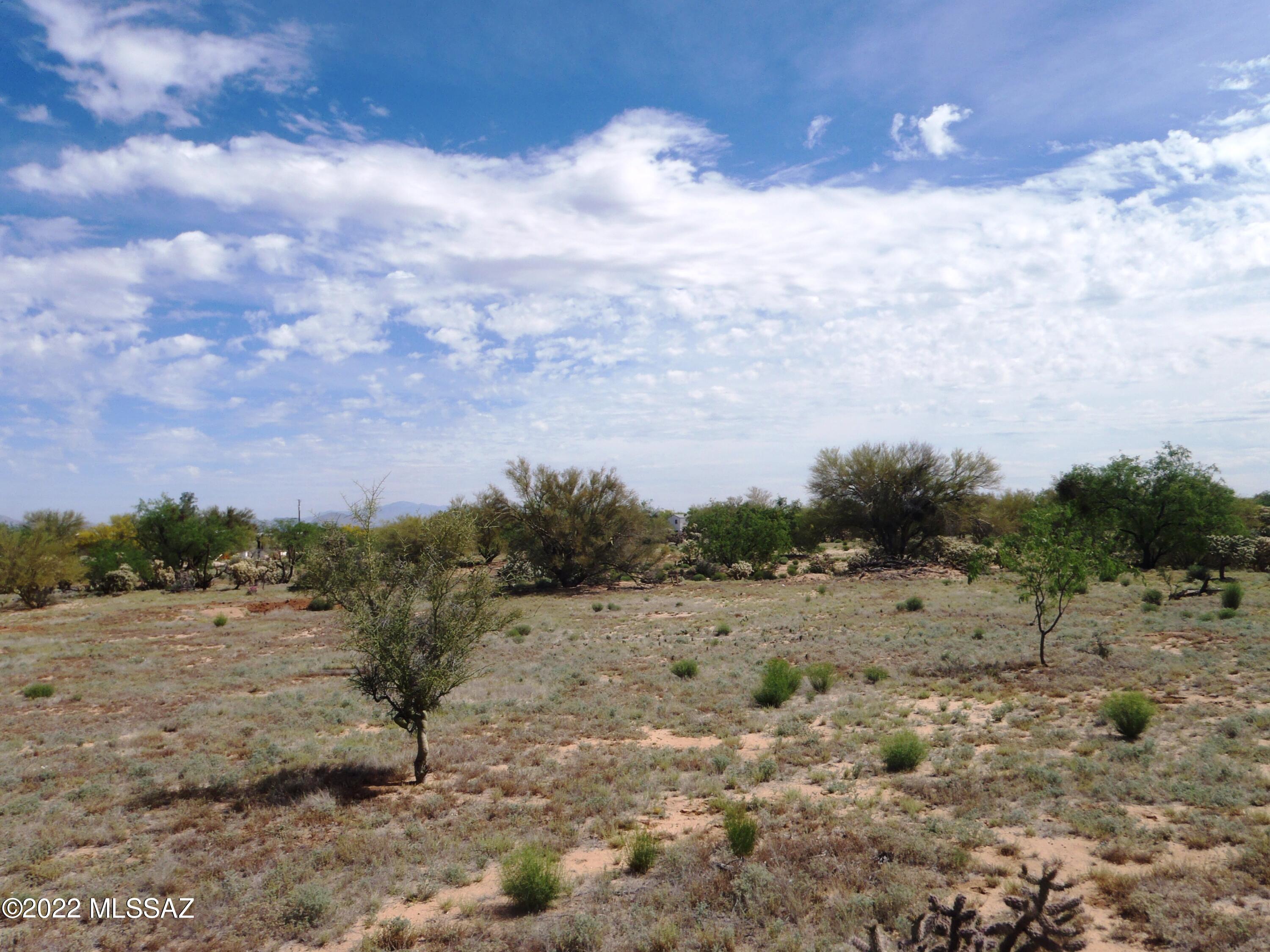 You'll love the location with views of Kitt Peak and mountains!  Just wait until sunset and thousands of stars come out!  Brand new septic tank is already installed saving you $$$.  Friendly neighbor to west sometimes has a vehicle parked on west boundary.  They will move it when asked.  Chumbler's Road is 150' wide yet only a small portion is bladed.  Property starts at electric transformers and water meters.