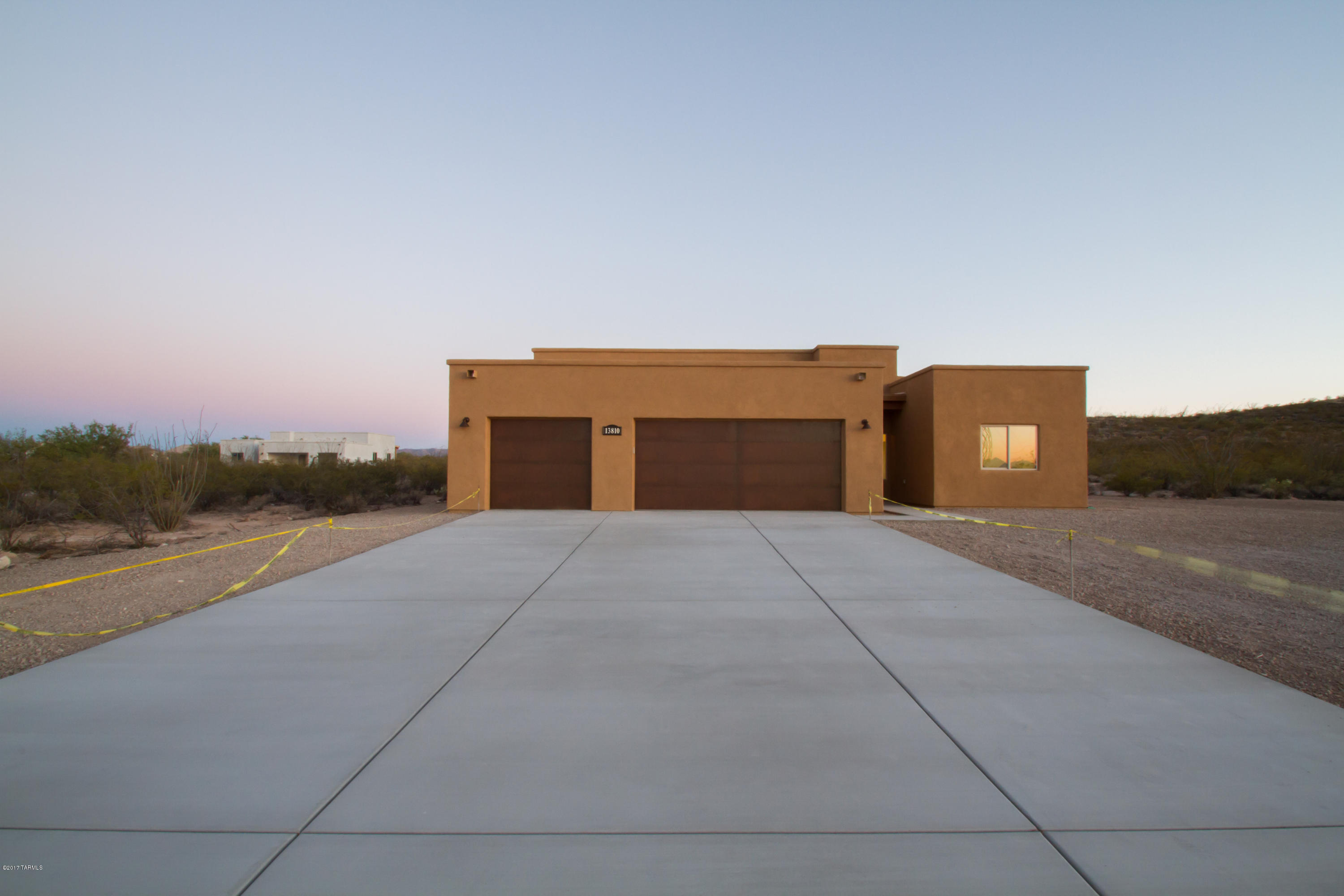 Brand new custom home! This gorgeous home in Vail sits on an acre of beautiful ocotillo filled land and features the finest finishes. At 1928 sq ft, there are 3 bedrooms, 2 baths, and a large 3 car garage. The open concept kitchen has beautiful cabinetry, with tons of storage, a large breakfast bar, double ovens, a stainless steel appliance package, canned and pendant lighting, and under cabinet lighting. The master bedroom features patio access, a huge master closet and a stunning on-suite bathroom with dual vanities, custom tiled walk in shower and a jetted garden tub with tile surround. The two other bedrooms are large, and have walk in closets. The 2nd bathroom has a gorgeous custom tile surround as well. All of this plus much more on an acre in Vail Schools. LA is related to seller