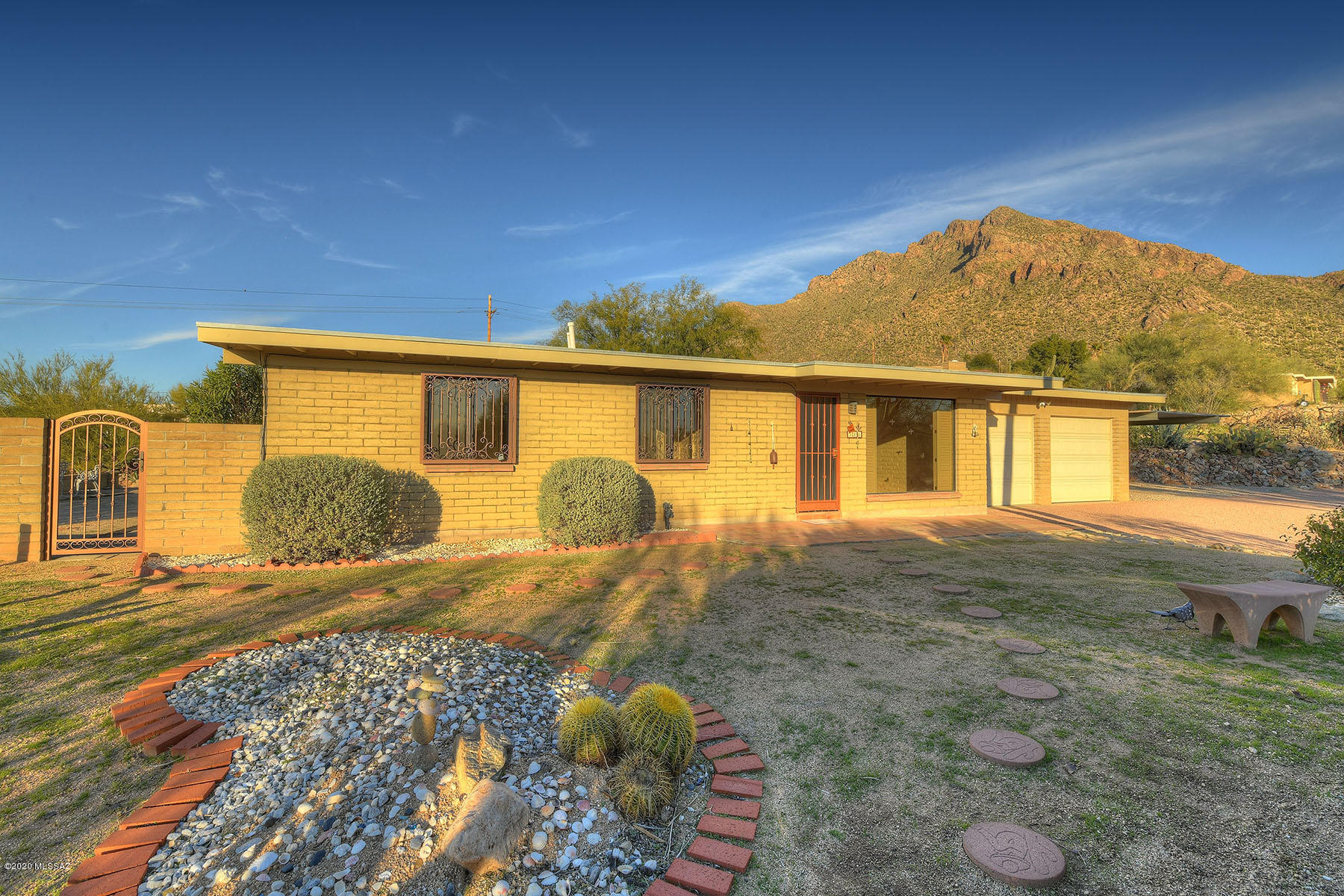 Jaw Dropping VIEWS of Dazzling City Lights, Catalinas, from Sun Up to Sun Down!-Masonry Home on Quiet Ridge Side, 1+ Acre-Updated Kitchen has Maple Cabinets-New Interior Paint-NO Interior Steps-NO HOA-Separate Artist Studio/Exercise Room(288 SF) is well finished with great North Light-Super 2 Car Garage and attached 2 Car Tandem Carport, Covered Porch faces North and is an amazing spot to watch wild life and the colors change on the spectacular mountain range.  Beautiful Wrought Iron Security Doors-New Roof in 2012-Many Updates-Very Private-Truly a Slice of Heaven!