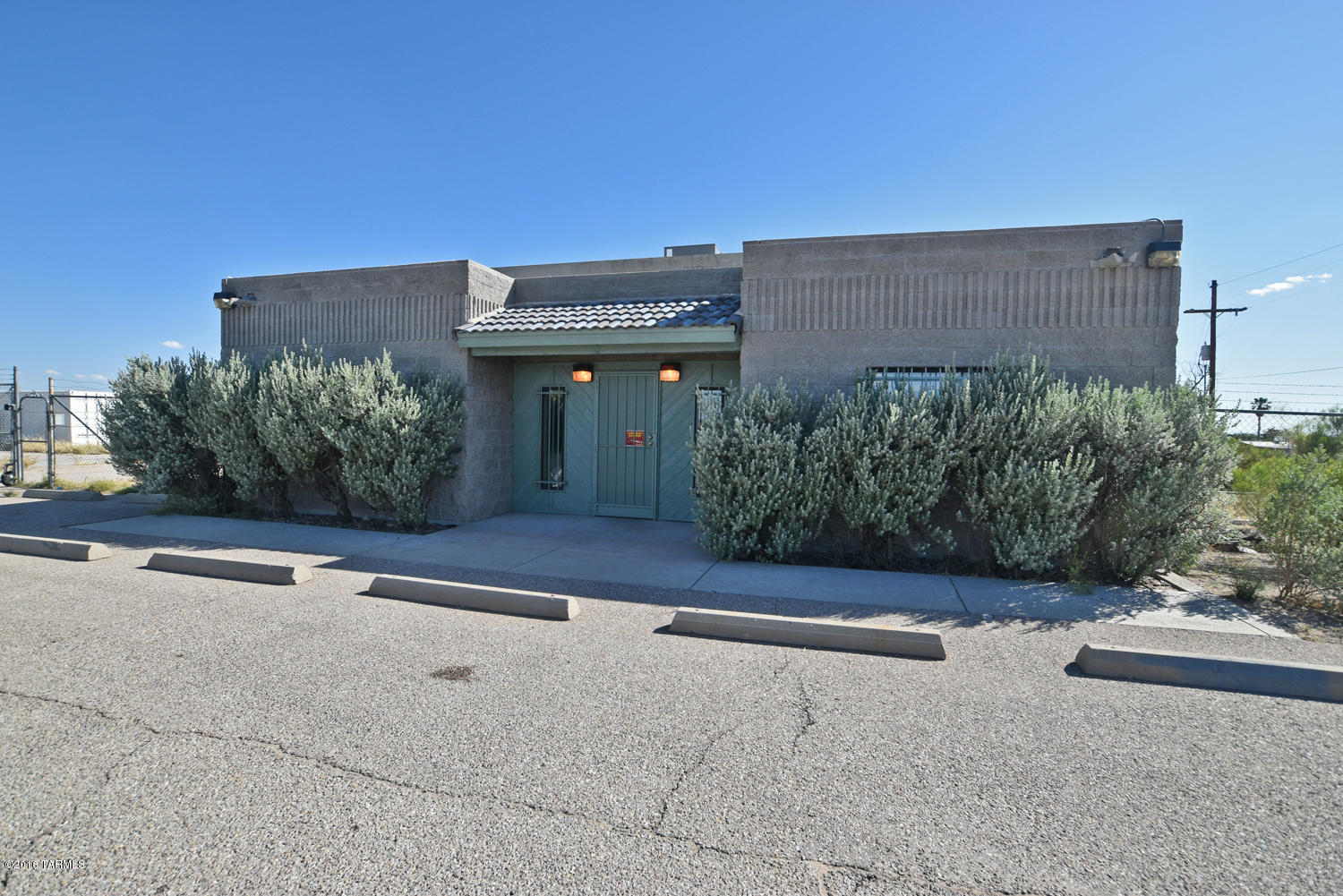 Incredible Development Potential 4 acres of CB-2 Zoned Land with a 1906 square foot block contractors office, warehouse, and fenced yard. Also two large modular buildings on the property. Less than 1/4 mile to the Valencia on ramp for I-10. Building was constructed in 1994. Front portion of building is an office and bathroom 8 foot ceilings. Back part of building is a warehouse with 15ft ceilings and roll up door 30 foot ceilings. Many opportunities here with a CB-2 Zoned parcel of this size and prime location with excellent visibility and access. Property is priced at recent appraised value.
