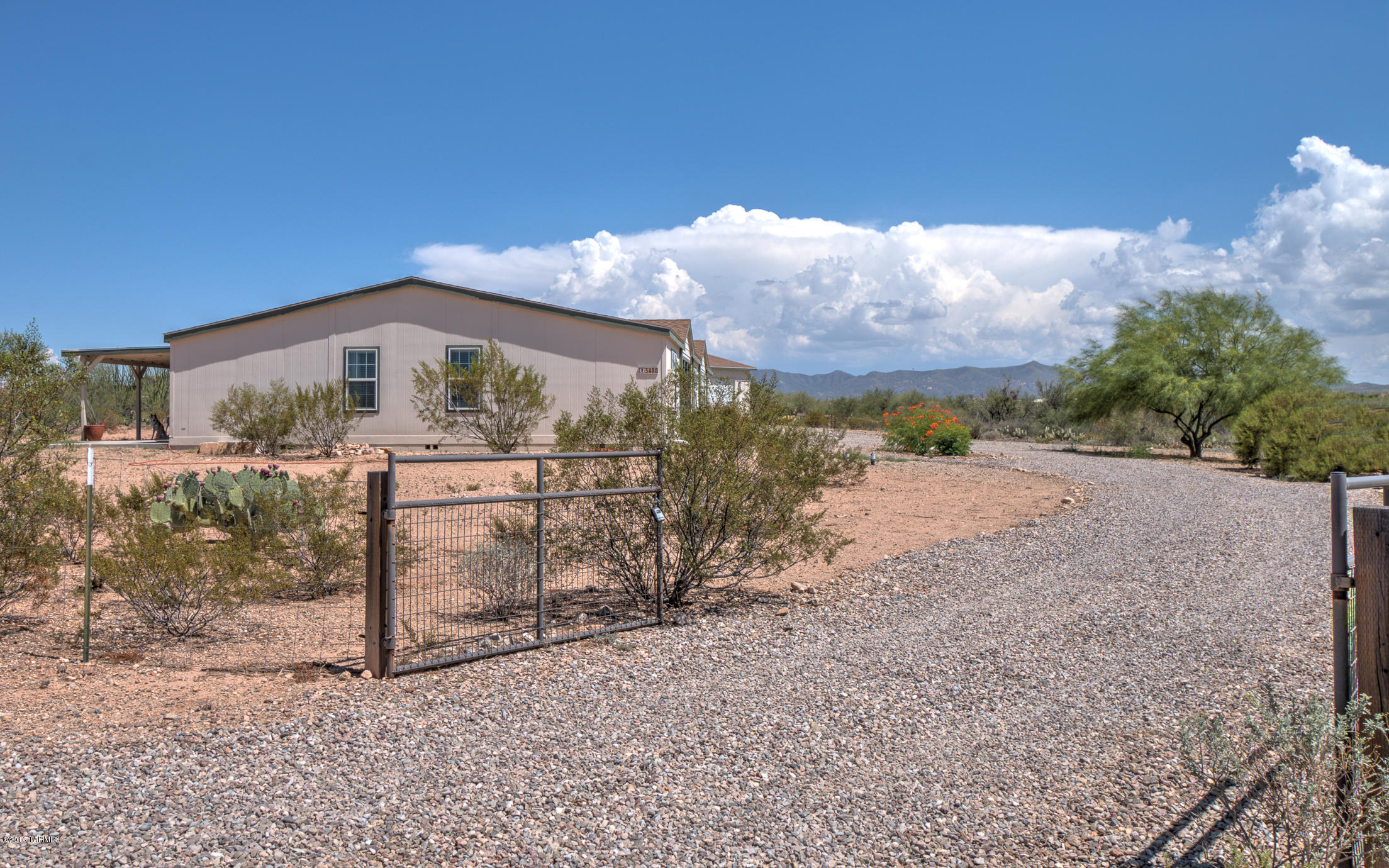 Here it is! Located in the award winning Vail Unified School District, this 1 acre lot has a view that must be experienced. Landscaping is courtesy of Mother Nature to include a few desert bunnies. Make this peace of heaven yours today - bring the family, the pets, your horse and chickens! 4 bedroom, 3 full bathrooms, a little over 3,000 sq ft manufactured home on a 1 acre lot....BONUSES...2 of those bedrooms are ensuites and the master bedroom also has an office/nursery/studio! This home backs to the desert AND, best of all, it's on Vail water and off a paved road! So it's eligible for VA and FHA financing! And one of the best added bonuses...a detached 2 car garage with a workshop area! What are you waiting for?!?! Welcome Home!