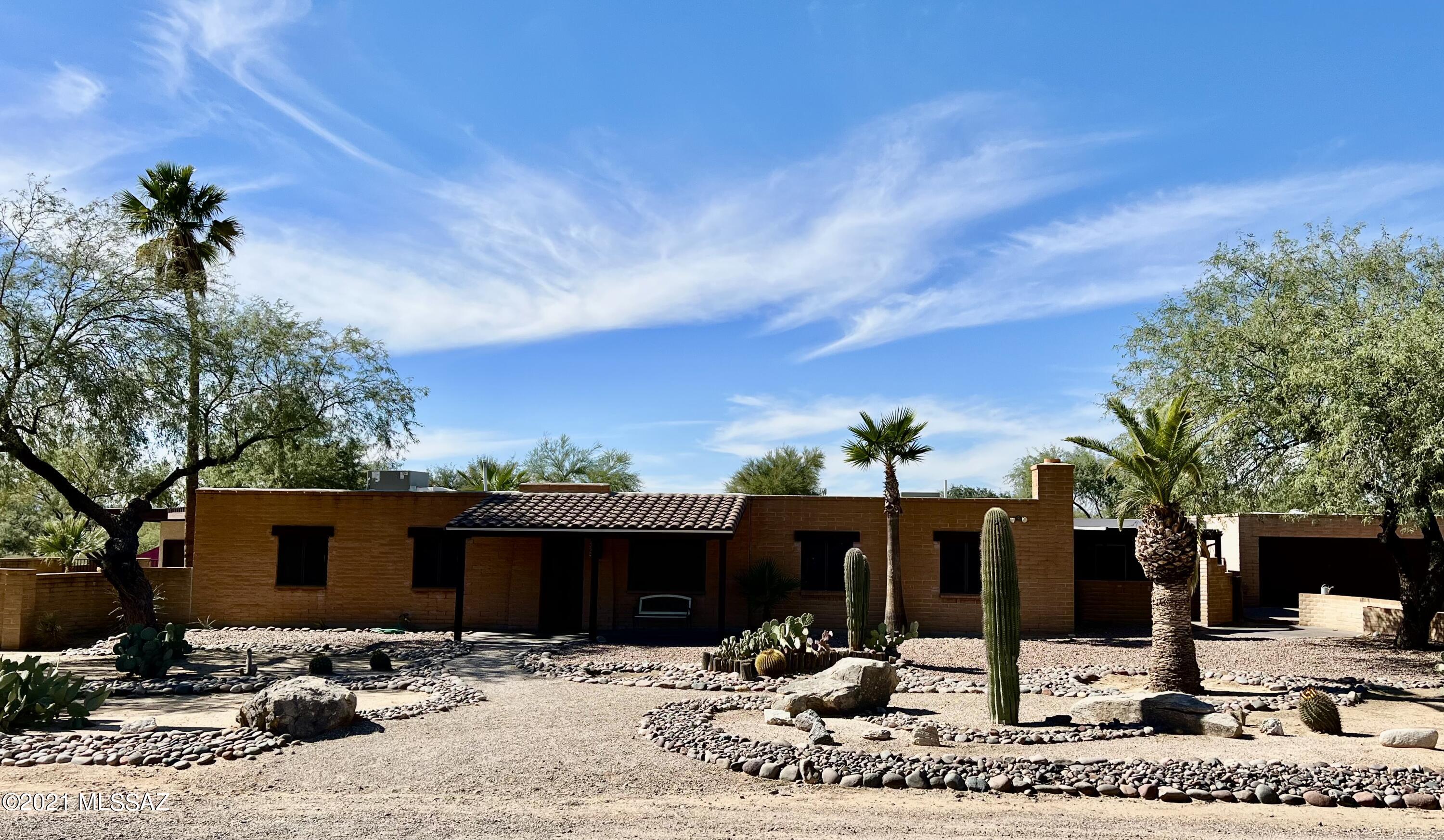 This Casas Adobes beauty won't last long! Beautifully remodeled with a pool, hot tub, horse facilities and more!
