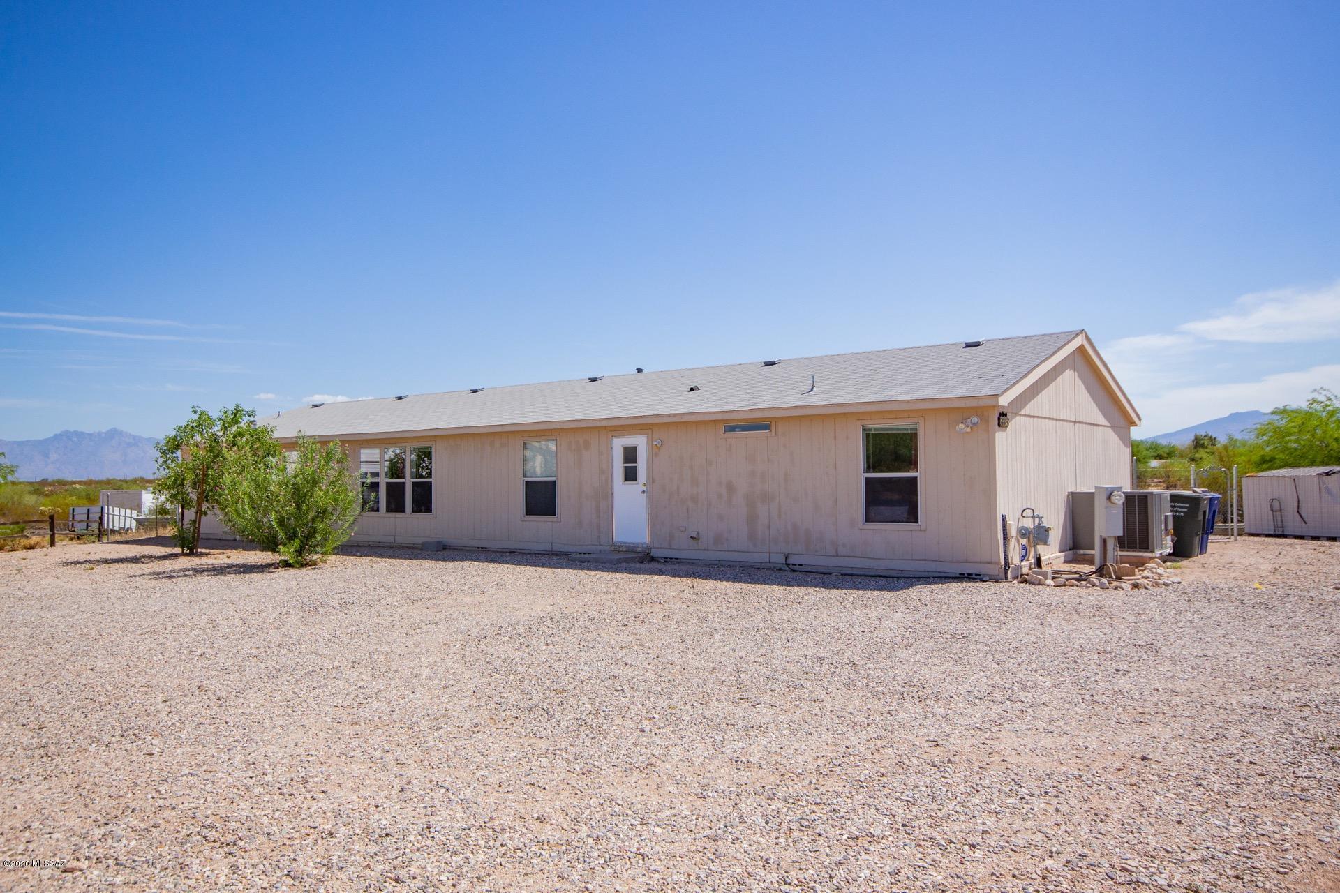 Spacious Home & Horse Property situated on over 1.3 acres of land & surrounded by Mountain Views. Vaulted ceilings, window blinds, ceiling fans, & open floor plan. The large kitchen features a breakfast bar, center island, SS appliances, & plethora of wood cabinet sw/hardware. Formal dining area w/service counter & wonderful views. 4 Generous sized bedrooms, ample closets,3  baths, &  plush carpet. Laminate wood floor in 2nd bedroom. Master suit has a his and hers bathroom. and Interior laundry room for your convenience. Lots of room for a pool, toys, RVs & Horses!!