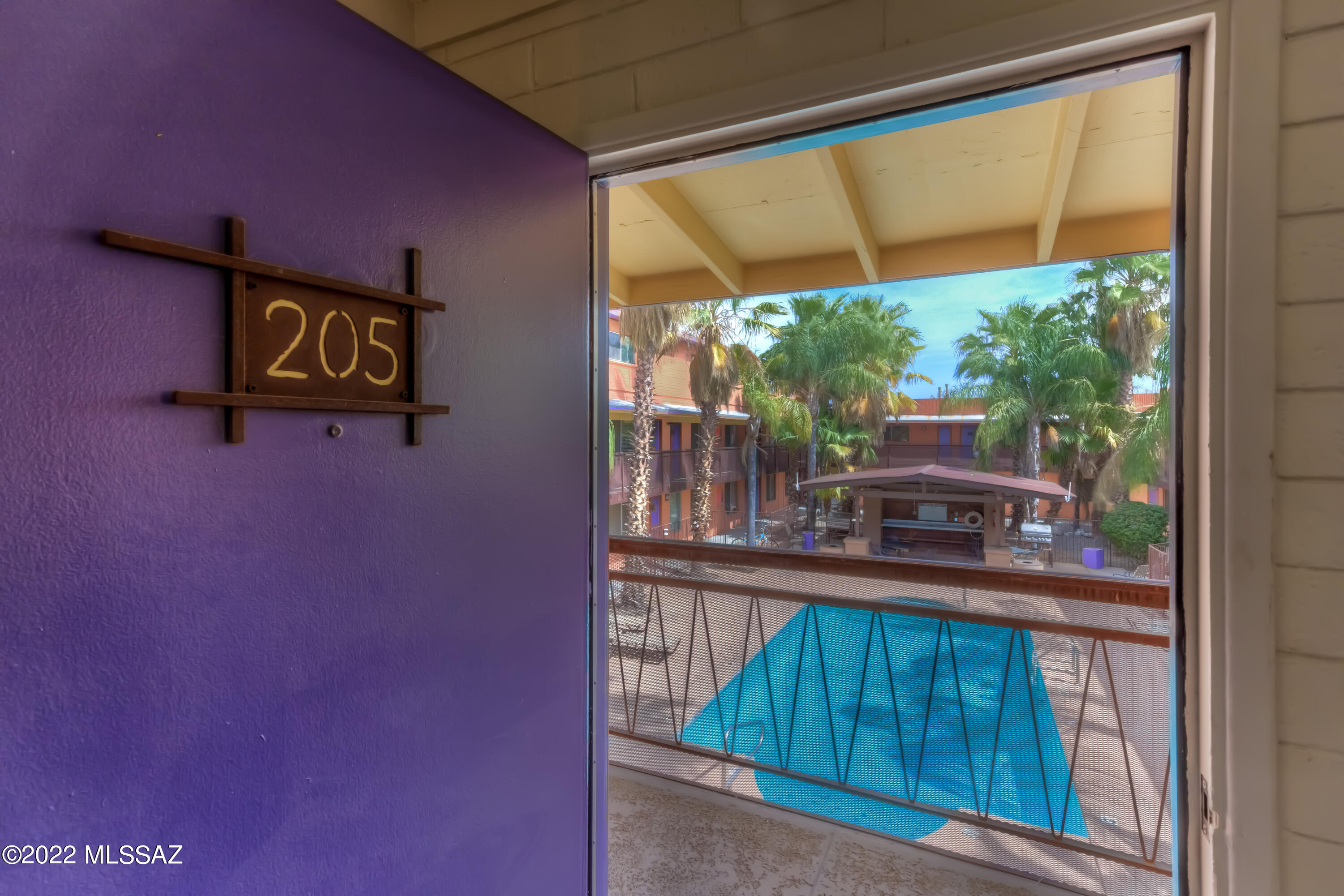 Welcome Home to this contemporary Condominium in the centrally located 10th St. condo complex!   Featuring 822 sq.ft., 2bed, 1bath, spacious Kitchen, in-unit laundry and a welcoming Living Room, this second-floor unit is sure to exceed your expectations!   The gated community features a sparkling pool!  One designated (off-street) parking spot is included.  Close to the University of Arizona, Downtown, I-10 access, shopping, dining, medical and recreation, the location can't be beat!! HOA covers trash, common area maintenance and exterior/roof maintenance.   Utilities/Internet are not included. See our 3D Walk Through and schedule your private tour today!