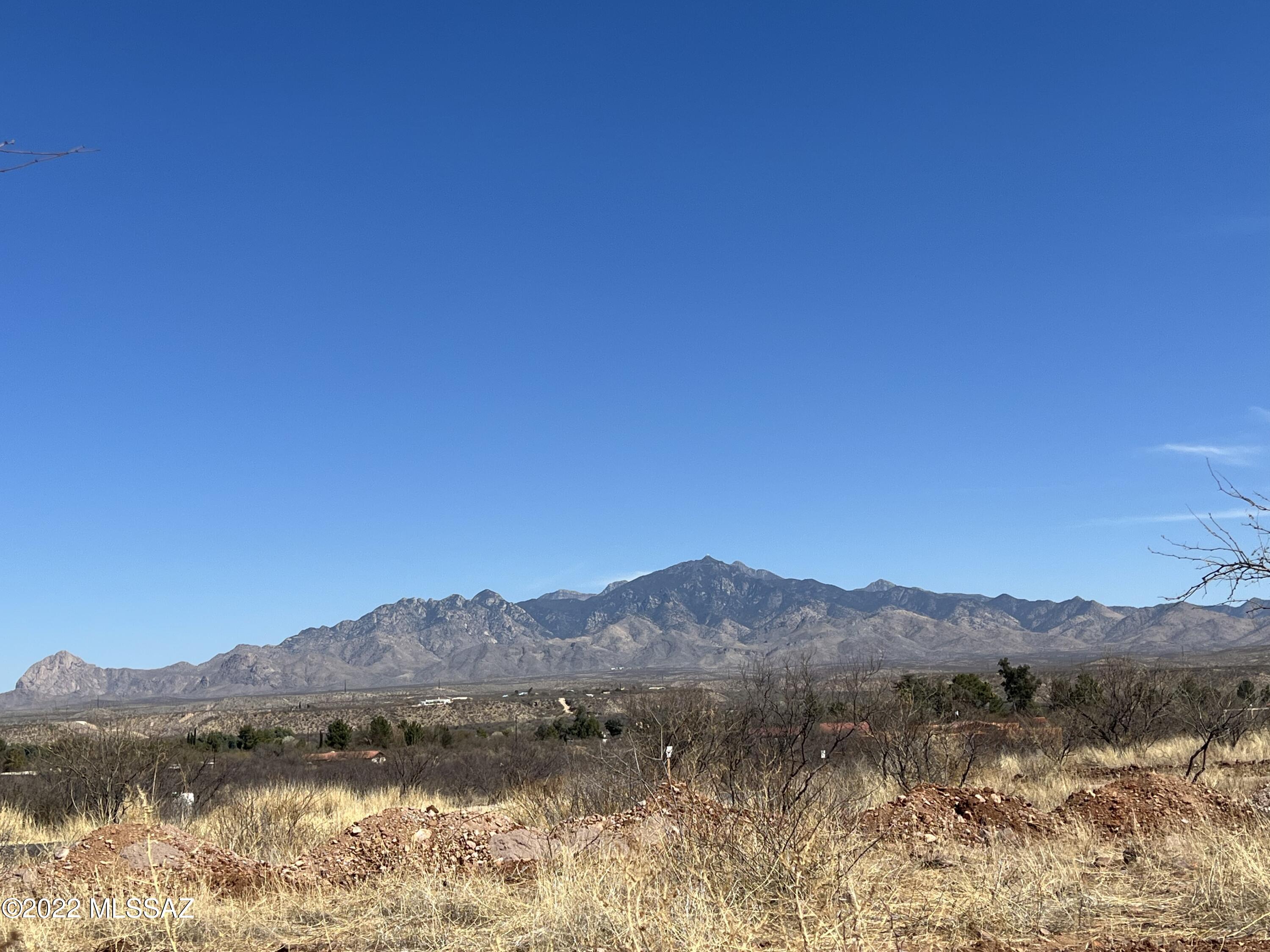 Large elevated lot with sweeping views of the valley and the Santa Rita Mountains. You may build now or later with the builder of your choice.