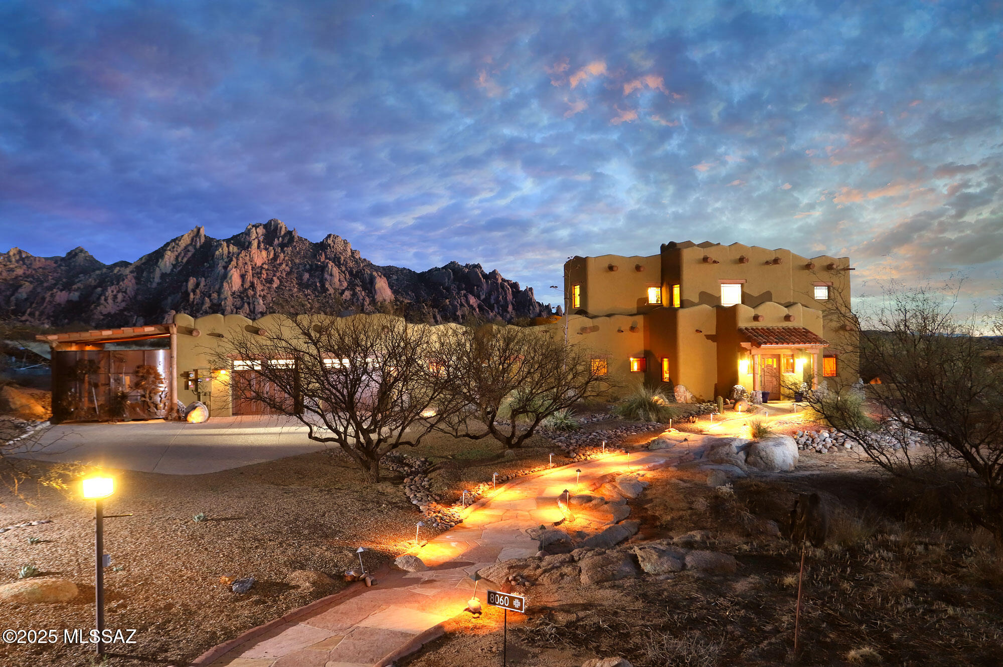 La Casa de los Peñascos (The House of the Boulders). Custom, organically designed, 4B/4B Santa Fe/Craftsman home and casita, set in a garden of granite boulders. 36 acres of high desert, bordering the beautiful Coronado National Forest. Open your eyes each morning to breathtaking views of the Dragoon Mountains. Luxurious and livable open floor plan. Granite, unique tilework, custom cabinetry and detailed touches, with quality materials throughout, in an impeccably maintained home. Private second-floor Master Suite, with office. Set in Dragoon Mountain Ranch, a gated, horse friendly community, with sensible CC&Rs to protect your investment. Heaven for those who love open space and captivating views. to ride horses. walk dogs and explore the unique beauty of the historic Cochise Stronghold.
