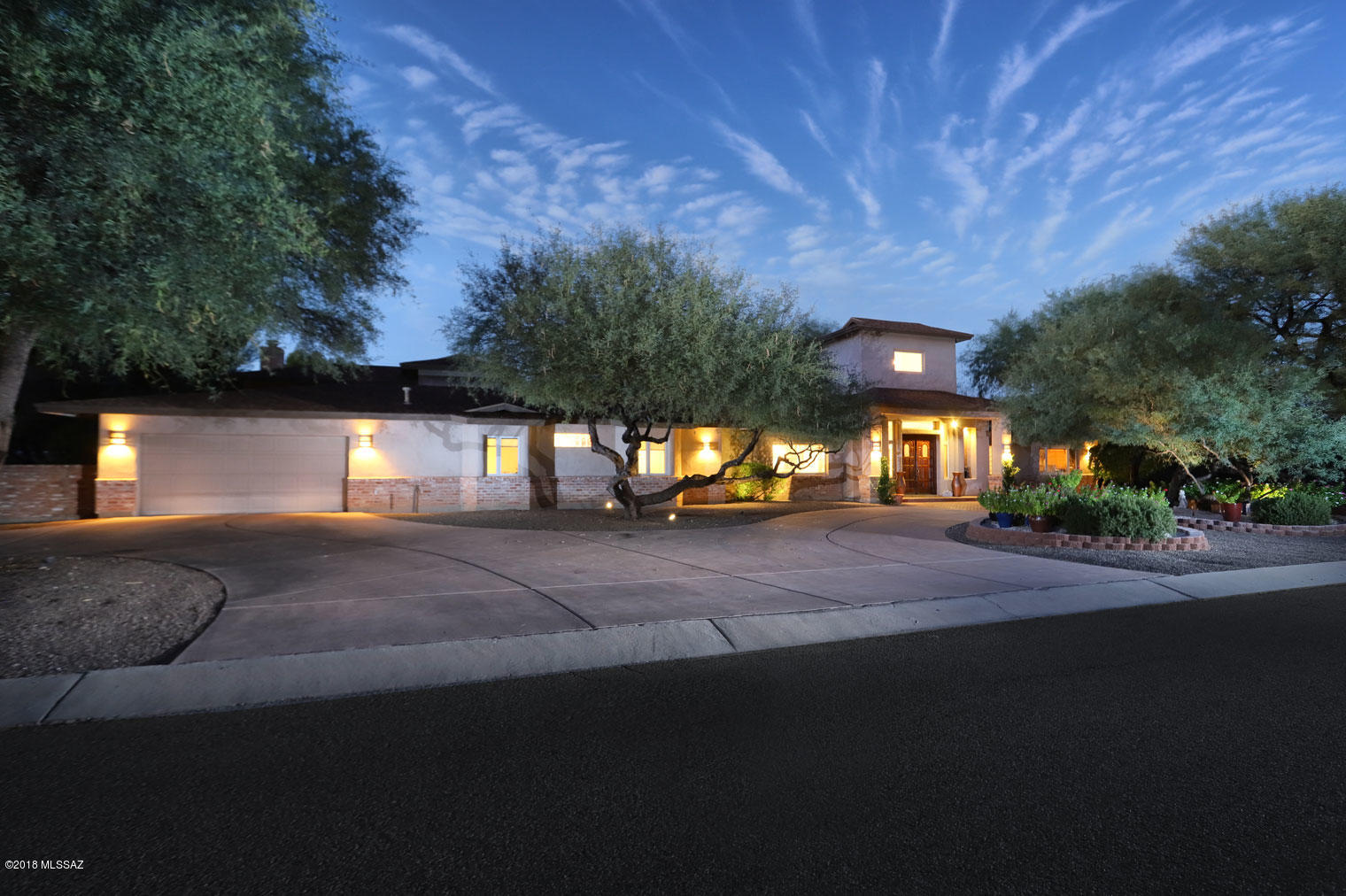 Are you looking for a home in Tucson's premier family friendly private community that checks off all the boxes?  Look no further! This home was completely rebuilt in 2002 with further remodeling in 2008 and 2018 and offers more than the competition at a price per square foot well below others.  Are you searching for an open floor plan, chef's kitchen, high ceilings, salt water solar heated pool, privacy, low maintenance yard, room for the entire family, split floor plan, home automation, solid surface floors and more?  Perhaps you are seeking some of the often overlook items of solid wood doors, Pella windows and doors, an abundance of storage areas, ceiling fans in most rooms, high efficiency multiple zoned hvac, LED lighting and centrally controlled speakers in every room. No matter what you seek, this home has it all and is ready for you and your family to start enjoying immediately. 
 
Walk through the front door and immediately be impressed with the 25 foot vaulted ceilings, the large stone faced wood burning fireplace from an entry that provides immediate access to the heart of the home.  The open plan boasts undisturbed sight lines between the enormous kitchen and family room.  Speaking of the kitchen, the whole family can gather around the 14 foot long island with seating for 6+.  Love to cook, you'll love the luxury appliances including a Thermador rangetop and exhaust hood, GE Cafe french door double ovens, Thermador built-in refrigerator, oversized sink, prep sink, pot filler and an huge walk in pantry.  You'll also find solid wood cabinets with pull out shelves and enough granite countertop to meet any particular need.  Want a more formal setting for a meal? Just off the kitchen is a large dining room with an attached bar area that provides continuity to the family room.  
 
While the family room, kitchen and dining room areas are the heart of the home, there are two wings for bedrooms in this ranch home.  This setup offers the perfect opportunity for those that want privacy while having enough space for guests, extended family or perhaps the teenagers that stay up all night.  In the north wing of the home you will find two bedrooms both offering walk in closets, en suites and excellent views from the oversized windows in each room.  The south wing of the home offers 2 bedrooms that share a jack and jill bathroom and a master suite that boasts an attached library with its own office space, an extra large spa quality bathroom and cedar-lined walk in closet.  
 
The back yard features a pool with recently upgraded high efficiency equipment, plenty of entertaining space and access to the yard for your four legged family members via an electronic bullet proof doggie door.
 
You can move in as soon as you close and start enjoying life in the premier private community in Tucson.  Tucson Country Club Estates is conveniently located close to shopping, medical care, downtown and even the airport.  Not to be overlooked, the family will have easy access to all the amenities offered at Tucson Country Club which offers a wide range of separate memberships for based on your interests.  Visit today and discover all the little things that make this home the best value in Tucson Country Club Estates.