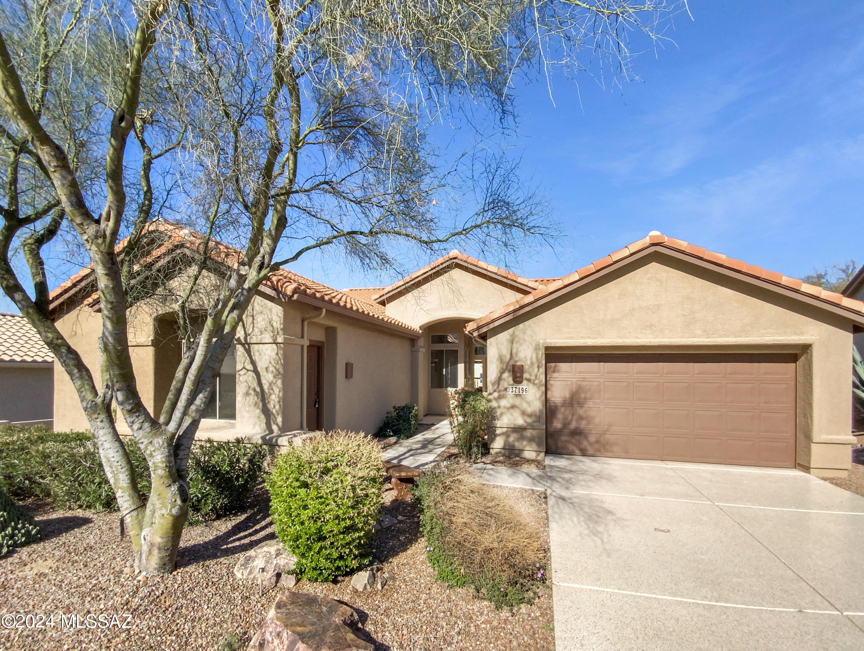 100-Day Home Warranty coverage available at closing.. Welcome home! Located in the highly desirable active adult resort community of SaddleBrooke with a lovely casita! This captivating property offers a serene ambiance with its natural color palette throughout. The spacious kitchen boasts a center island, perfect for meal prepping. With other versatile rooms, this home provides ample space for flexible living arrangements. The primary bathroom features double sinks, providing convenience. Additionally, the primary bathroom offers good under sink storage, ensuring a clutter-free space. Step outside to the backyard and relax under the covered sitting area. Some areas of the property have undergone partial flooring replacement, enhancing the overall aesthetic appeal.