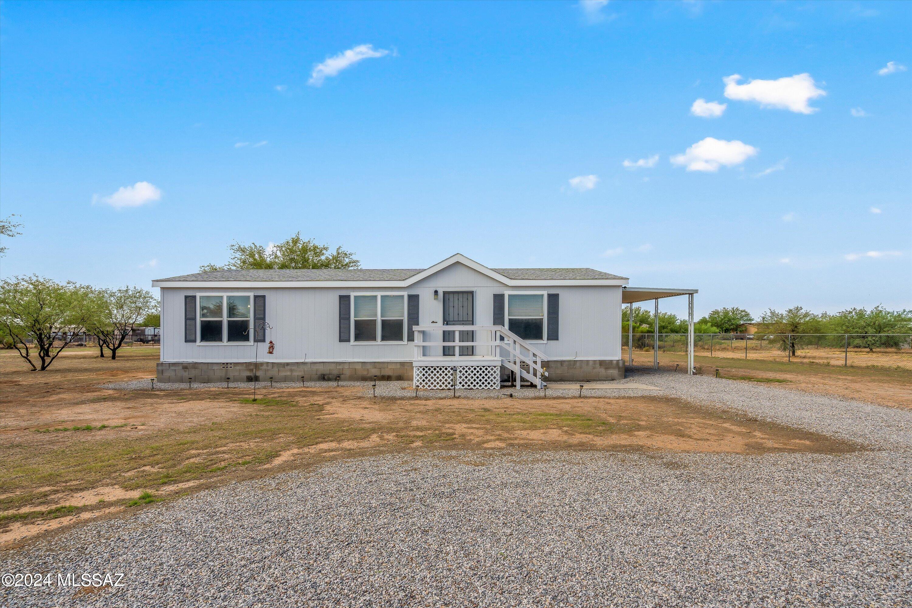 Welcome to your serene retreat in this charming manufactured home, nestled on a quiet cul-de-sac in a picturesque rural setting. This inviting 3-bedroom, 2-bathroom home offers the perfect blend of tranquility and convenience, with stunning desert and mountain views that create a serene backdrop for everyday living. Step inside to discover a bright and airy living space, enhanced by new kitchen appliances that make meal preparation a delight. The kitchen and dining area feature new windows, allowing natural light to flood the space and offering breathtaking views of the surrounding landscape. Enjoy the peaceful lifestyle of rural living with the ease of paved roads. Don't miss out on this unique opportunity to own a home where comfort meets natural beauty.