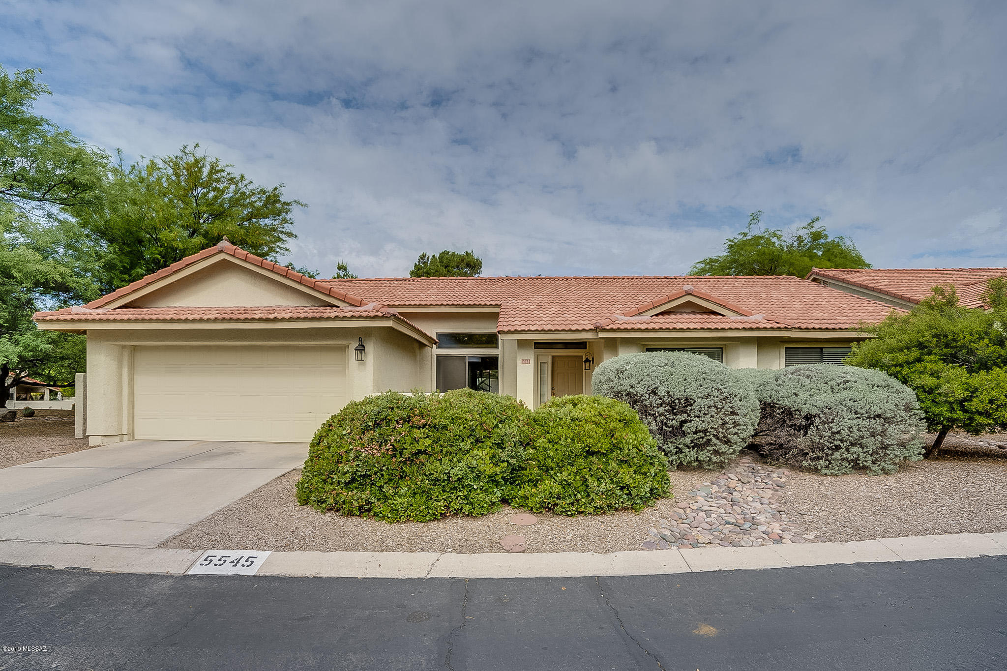 Seller will accept or counter offers between $300,000 - $315,000.  This home is ready to go!!   Located in one of the only District 16 subdivisions offering a community pool, the home offers separate living and family rooms, a dining room that can be as formal as you would like, a nice large yard, and located next to a common area and across from the pool.  Sellers have replaced old flooring with ''wood'' tile throughout.  Also replaced are appliances, guest bathroom shower and fixtures, and interior paint.  The location is fabulous! Walking distance to elementary and middle schools, and even better ... a short walk to Sabino Canyon! This is a lovely, lovely home!