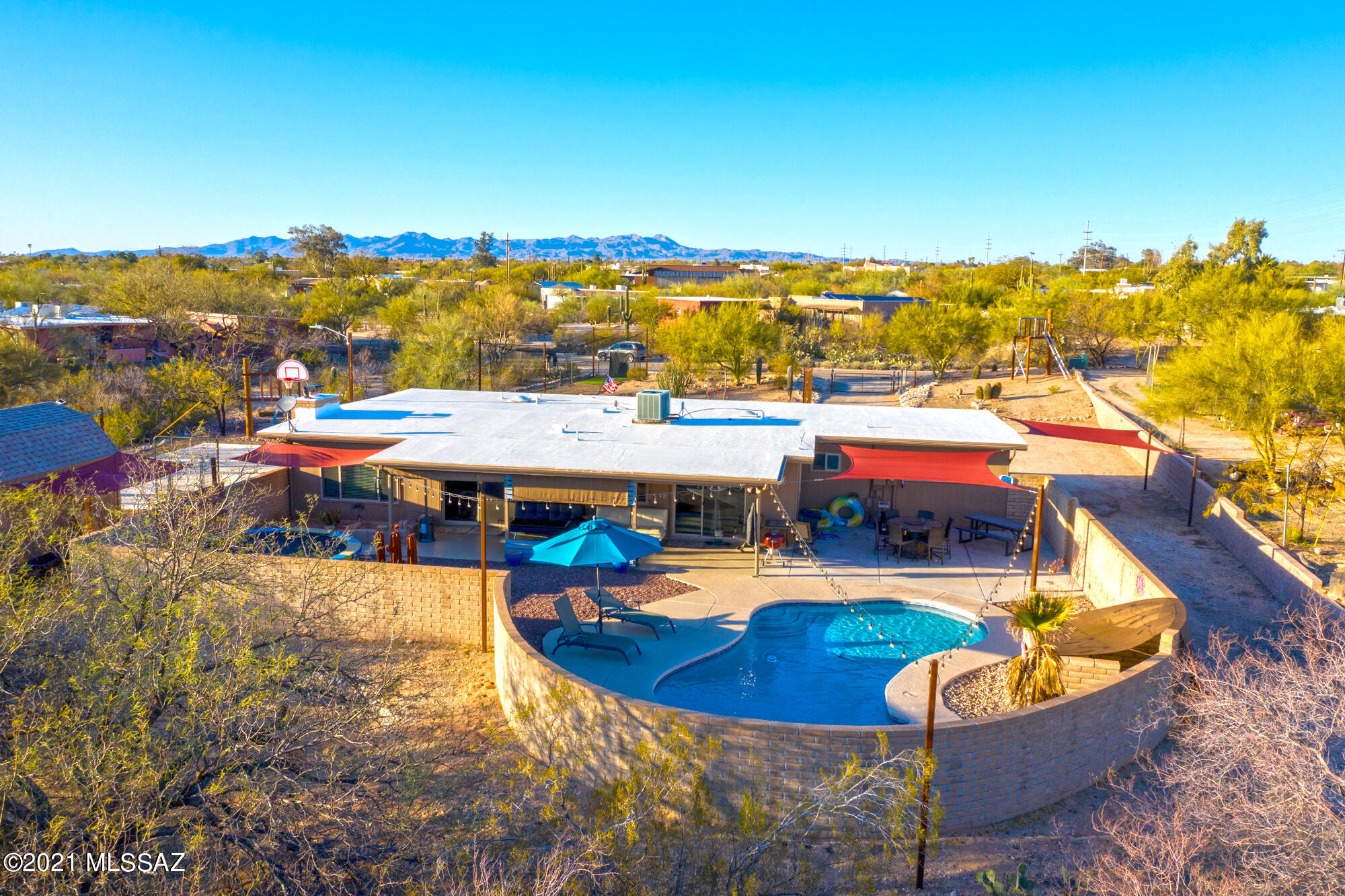 Seller to entertain/counter offers from $425k-$450k. Brimming with outdoor adventure, this exceptional home is where modern comfort meets an active lifestyle. Situated on 1.05 acres with distinct play zones for the whole family to enjoy, this home will become your favorite getaway spot! A premium sports cage for perfecting your swings or long shots, a concrete court for play or additional entertaining space, and a zip line to take you from one side of the yard to the other! In your downtime, enjoy relaxing or gathering with family and friends poolside. Inside, two sets of sliding glass doors flood the main living spaces with natural light. Updated luxury vinyl plank flooring, Milgard double pane windows and quartz kitchen and bath counters highlight the home's practical, easy-going design.