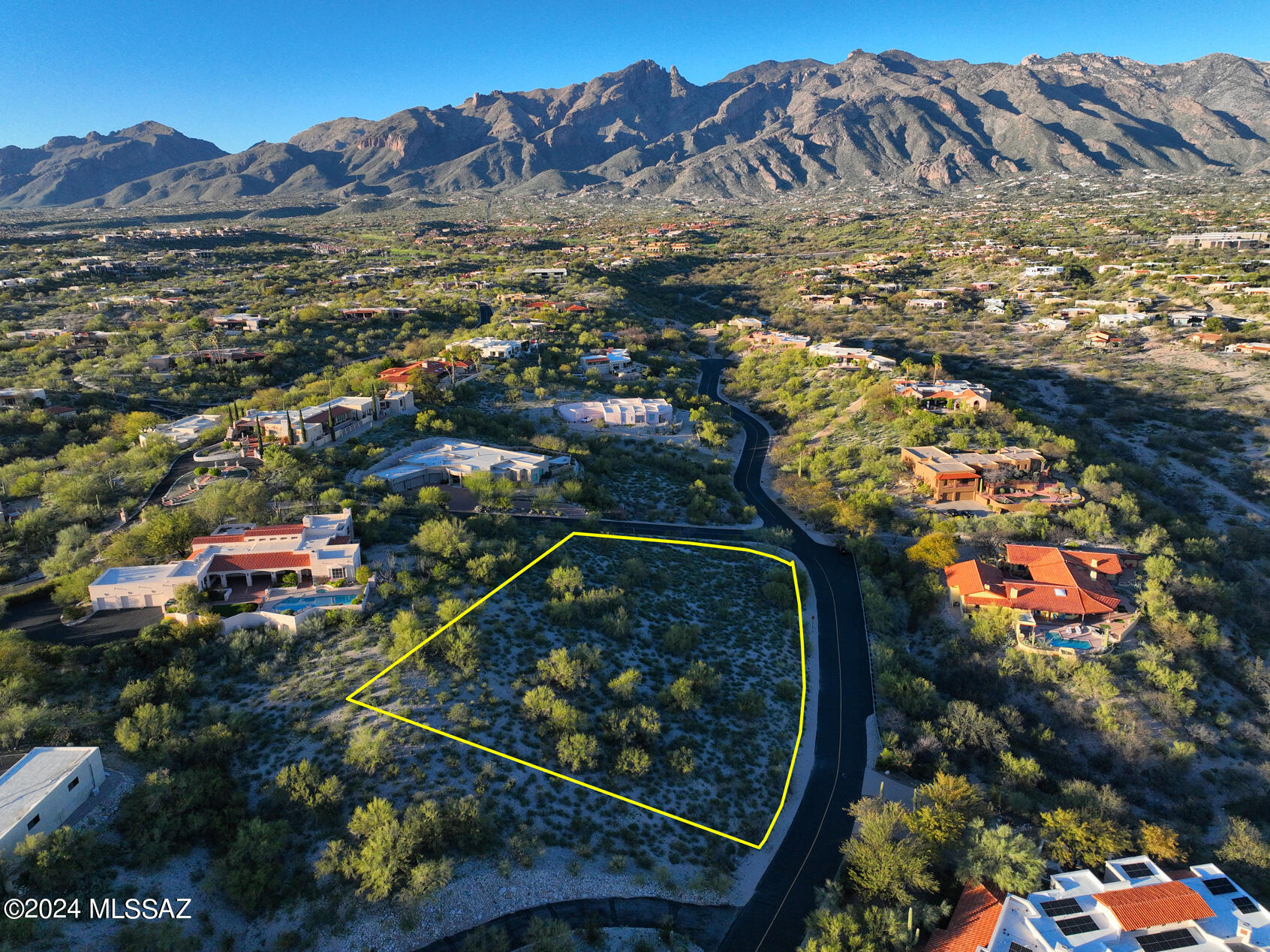 Rare opportunity to purchase this Breathtaking 1.22 acre hilltop lot in Gated Catalina Foothills Est #10. Unobstructed views of the Catalina, Rincon & Santa Rita Mountains and the City. District 16 schools. Beautiful natural sloping site. First time ever available! Topo and plans available.