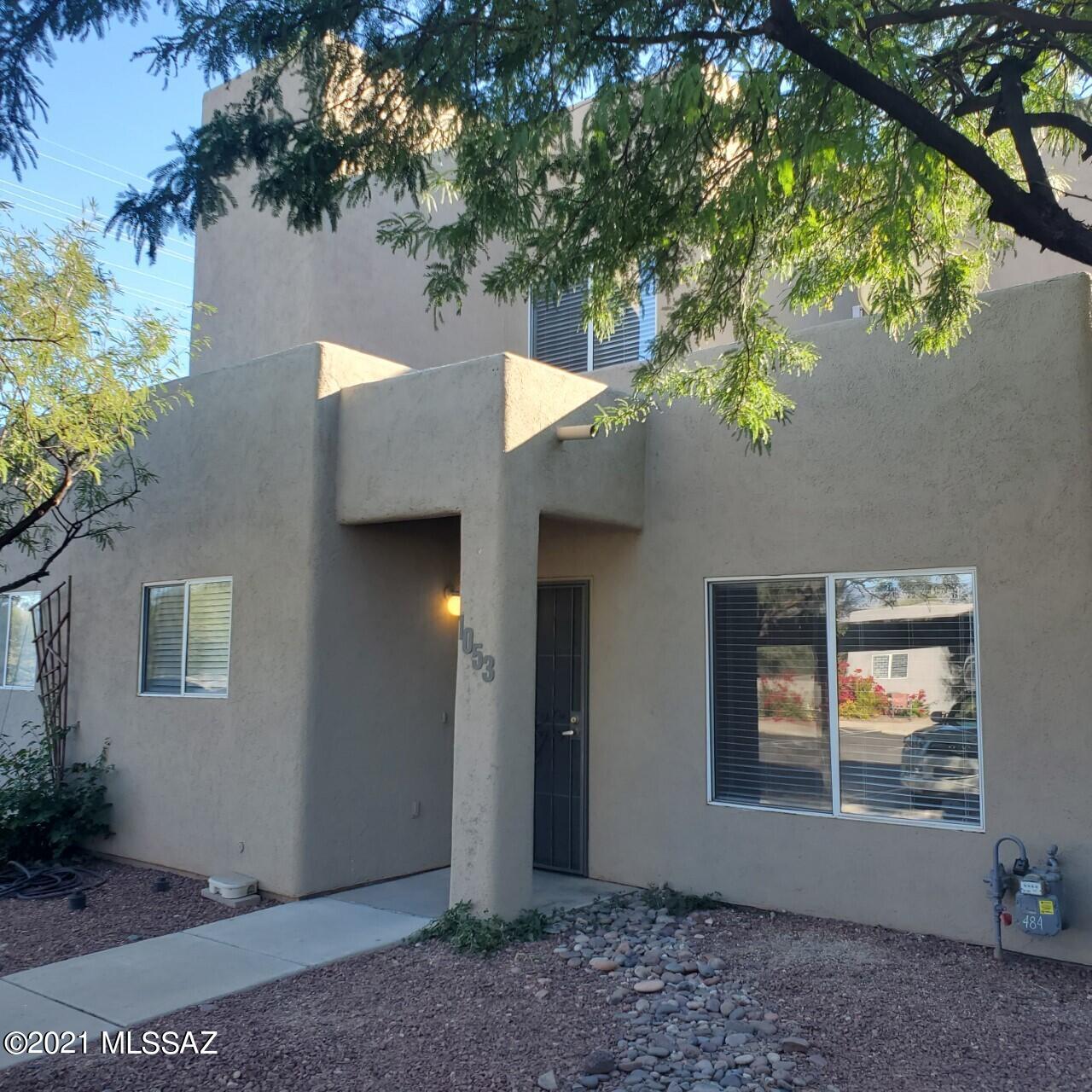 Newer wonderful 3BR/2BA townhome (TH) end unit. No one above or below. Updated with ceramic tile flooring (main level) and quality carpeting (2nd floor). Main level has high ceilings, spacious living room with electric fireplace, large kitchen, dining area, bedroom, bathroom and laundry closet. Upstairs has the 2 additional bedrooms and bathroom. Private rear yard has privacy block wall, large covered patio, extended brick patio and storage room. No residence directly behind this TH. Each TH has 2 designated covered parking spots. GREAT EAST SIDE LOCATION! Short walk to The Loop offering many miles of hiking and biking trails. Approx. 6 miles east of the U of A.