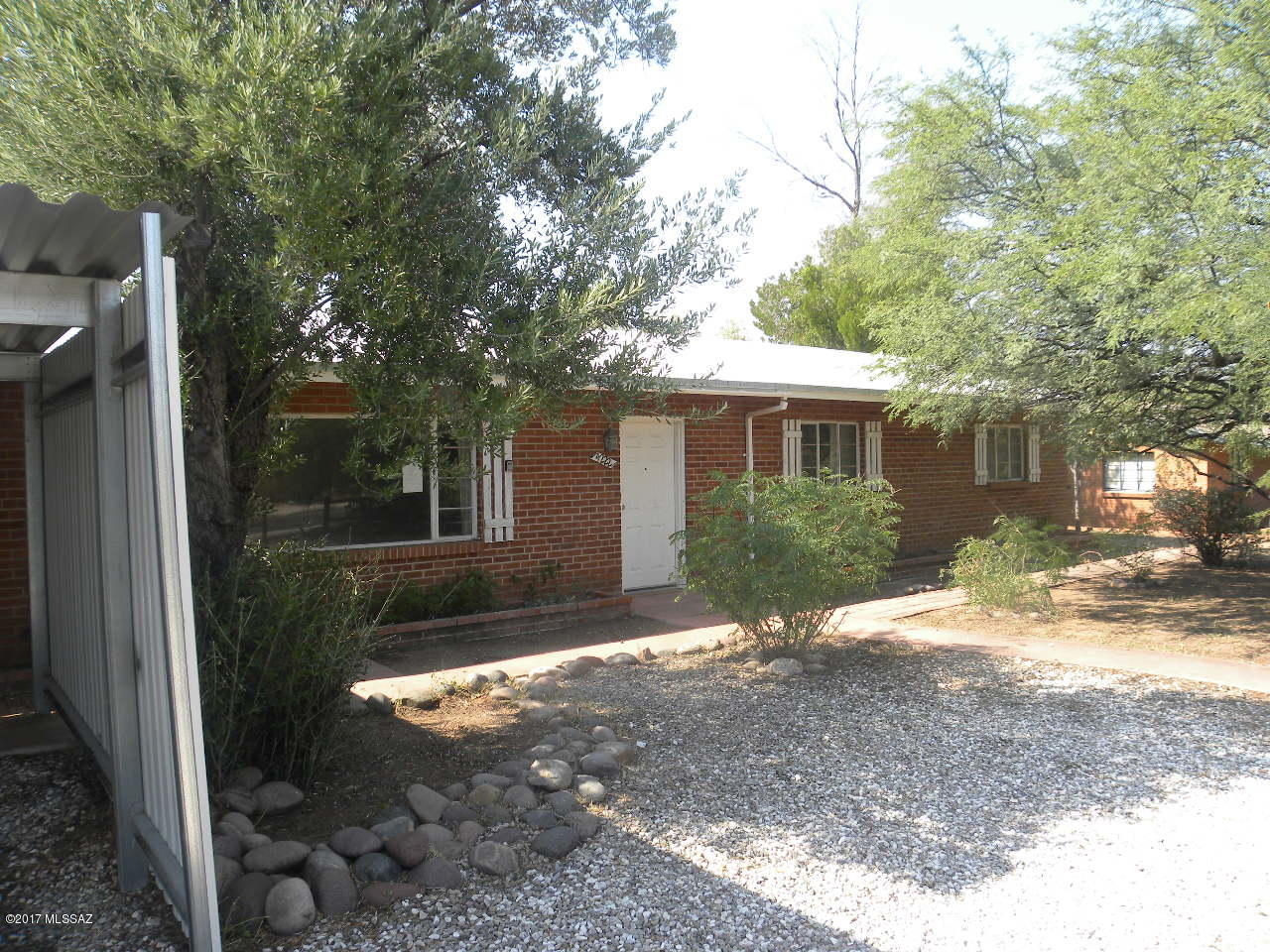 Great opportunities with this centrally located three bedrooms, two bath brick home. Established neighborhood. Nice floor plan with a bright kitchen, large living room and separate dining area. Large enclosed backyard. Easy care front yard. Covered carport and garage. Plenty of room for storage. Convenient location just minutes to downtown and U of A. Close to schools, shopping, and public transportation along 5th Street.Terrific for a growing family. Don't miss this opportunity, come see today!