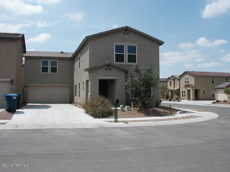 Spacious 2 story contemporary home in  Central Tucson location. Large eat-in kitchen opens to Living Room w/Fireplace. Bedroom + Full bathroom on first floor. Second floor loft plus 3 bedrooms/2 full bathrooms. Generous Master Suite w/walk in closet, Jacuzzi Tub, Shower stall, double sinks. Laundry rm w/Washer & Dryer on 2nd floor. Ceiling fans in all rooms. Walled yard w/Covered patio. Long driveway for off street parking. Lovely convenient location close to hospitals, schools, parks.