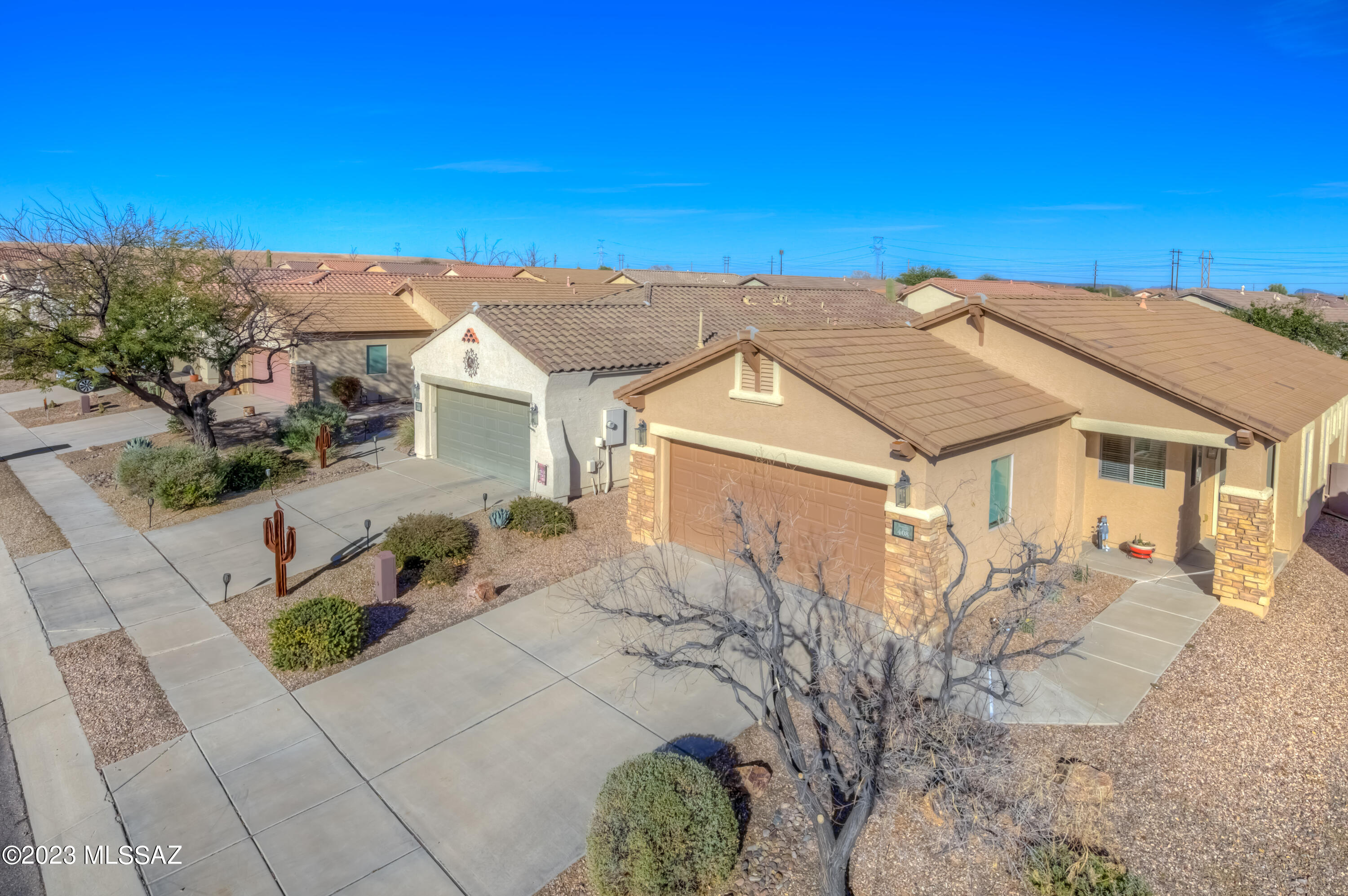 Turn Key 2 bedroom, 2 bathroom, single level home in Sahuarita. With clean architectural lines and stacked stone accents, the front of the home is built to impress. The open kitchen and great room floor plan are well thought out for easy entertaining. Relax in the primary bedroom suite with backyard views, a double vanity, and a spacious walk-in closet. Open the sliding glass door for easy access to enjoy the covered patio and the nicely landscaped and fenced yard. There is plenty of parking between the 2 car garage and the concrete driveway. The Sonora at Rancho Sahuarita Community offers a clubhouse, a pool, a spa, a fitness center, and pickleball ball courts.