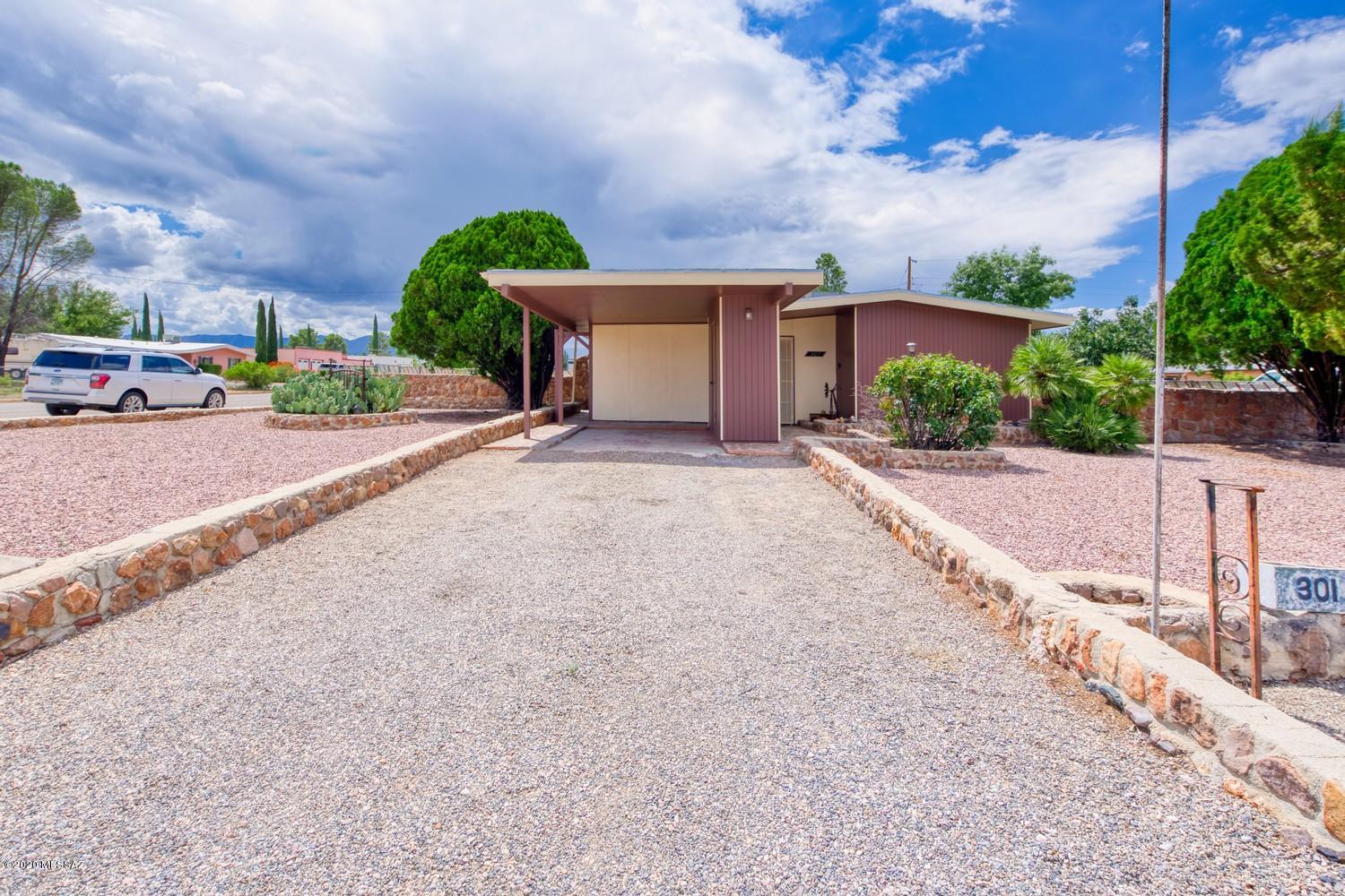 This 1965 Mid Century Modern Home is fully restored with modern amenities: Tile throughout, Ceiling and wall LED lighting, new plumbing and a home office/guest quarters/studio. This home is small in size and large in upgrades. It is a ''model move in ready'' home.

The kitchen includes new dishwasher, new stove, sink and faucet as well as new counters with a garbage disposal, under cabinet lighting and the new water  panel for your refrigerator.

The living area has up to date ceiling LED lighting and the whole house has new windows. A beautiful sliding door leads to the newly enclosed screened sun room.

A laundry center is positioned just outside the bathroom, between the bedrooms.  New ceiling fan lamps and solid pine doors add to the upgraded bedrooms. The retro home also includes central ac/heat. 

The home office/guest quarters/studio has a new mini split unit with a half bath. It is tiled throughout with matching tile to the main home.  A stainless steel counter/sink unit is handy and accommodates the mini frig/snack center for work or guests.

Double access gates from the street open into a large back yard.

301 Ford is centrally located in Sunsites, near the Post Office, Library, Restaurants and Shops.