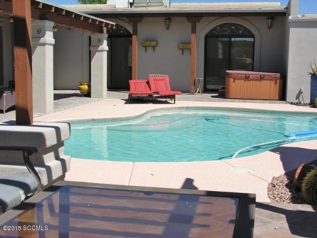 Extraordinary property! Upgraded home on 4+ acres, fantastic views,horse stalls & tack rm. Gorgeous walled patio, swimming pool, outdoor kitchen BBQ, ramada area w/fireplace & huge covered porch. Extra space galore with 572 sq ft theater/game/bed rm. Detached garage w/separate 435 sq ft office/ work shop attached. Upgrades include tile floors, granite counter tops, huge open kitchen & family area, lg master bdrm w/ fireplace & private patio, master bath dual sinks & designer walk-in closet.