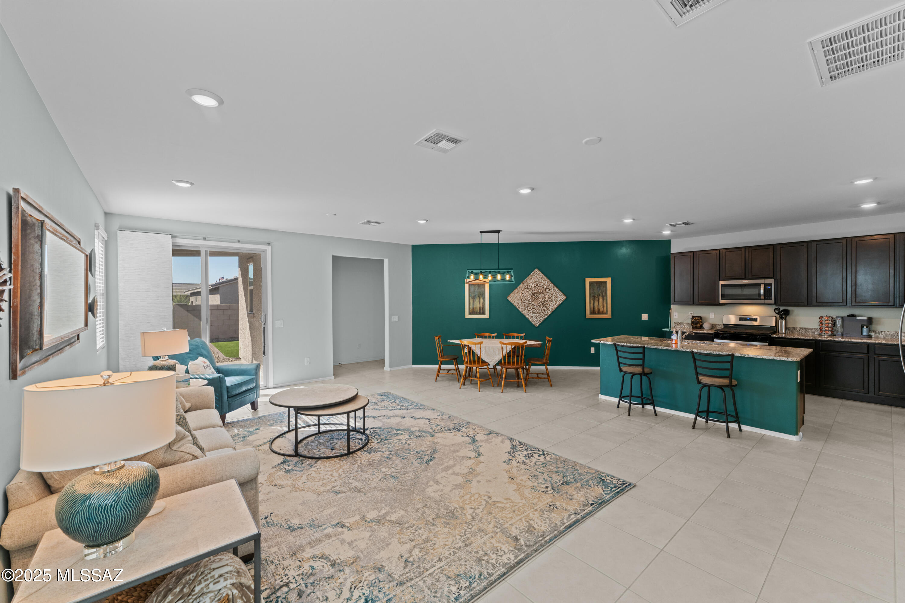 Discover a perfect blend of modern comfort & thoughtful upgrades in this pristine KB home. A spacious & well-designed floor plan, this residence offers 3 generously sized bedrooms, 2 stylish bathrooms & a convenient split-bedroom layout for ultimate privacy. The owner's suite is a true retreat, featuring a luxurious walk-in shower, dual sinks & an expansive walk-in closet. Storage is plentiful, with walk-in closets throughout. The dedicated laundry room, complete with cabinets, washer & dryer adds extra convenience. Step outside to beautifully finished front/back yards, meticulously landscaped for easy maintenance & enhanced curb appeal. Extended back patio elegant pavers provide the perfect setting for relaxation or entertaining. 2-car garage rounds out the impressive list of features.