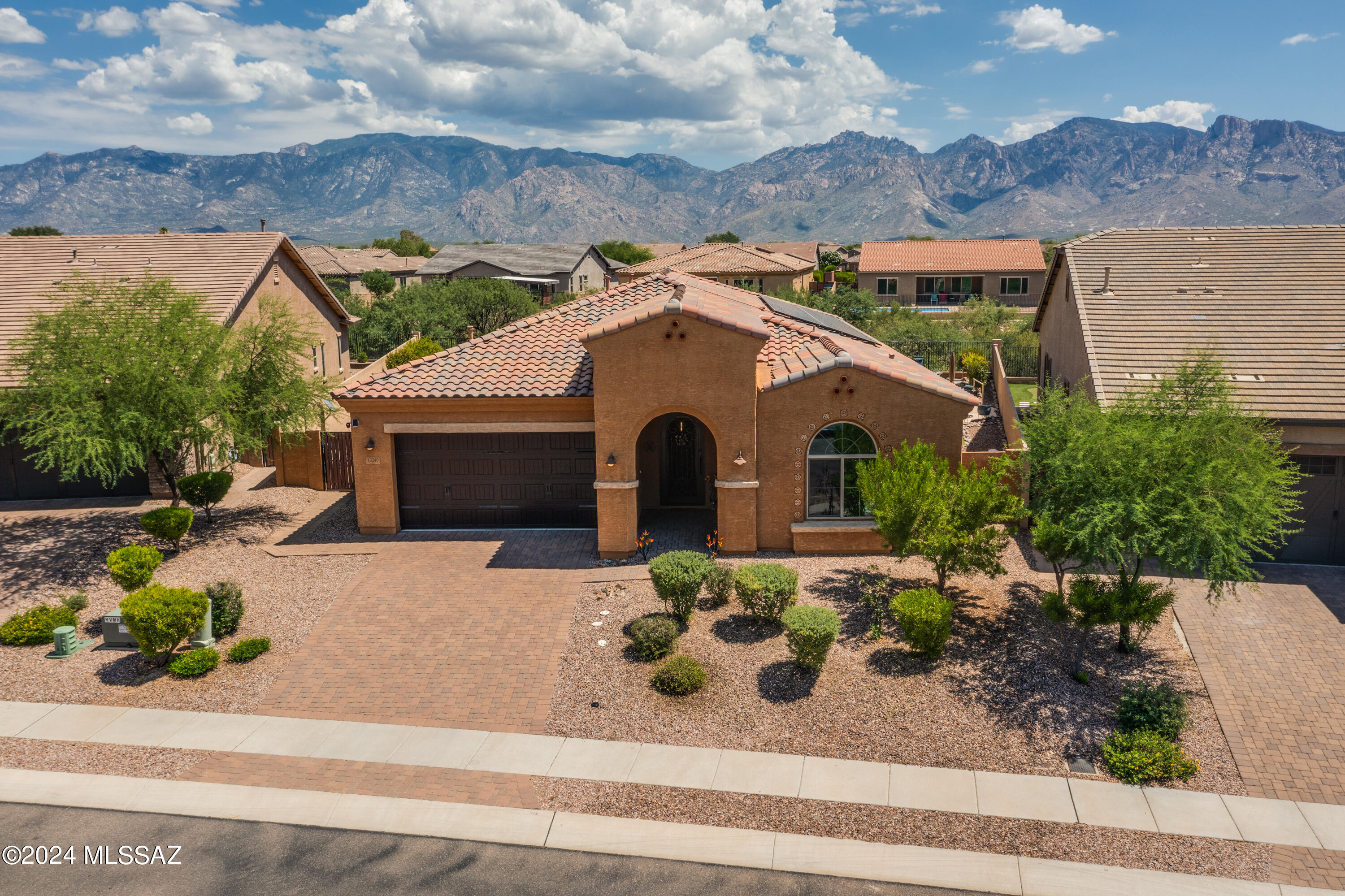 Pristine 3BD/2.5BA +Den (2,481sf) Clifton model in the gated Cove at Center Pointe Vistoso with fully paid leased solar from Sunrun. The open concept home w/10' ceilings features a gourmet kitchen with SS Appliances, granite island, 42'' cabinets, backsplash, pantry & pendant lights. Numerous upgrades throughout including custom lighting, plank vinyl tile, plantation shutters, barn doors, large laundry with sink & cabinets & water softener.  Owner's suite hosts a luxury bath with 2 vanities, jetted tub & walk-in shower/closet. Step through living area's large sliding glass doors to the professionally landscaped backyard with mountain views, extended covered patio, pergola, Zen water feature, pool & outdoor shower. Enjoy Center Pointe's clubhouse, park, pool/spa/splashpad & walking trails.
