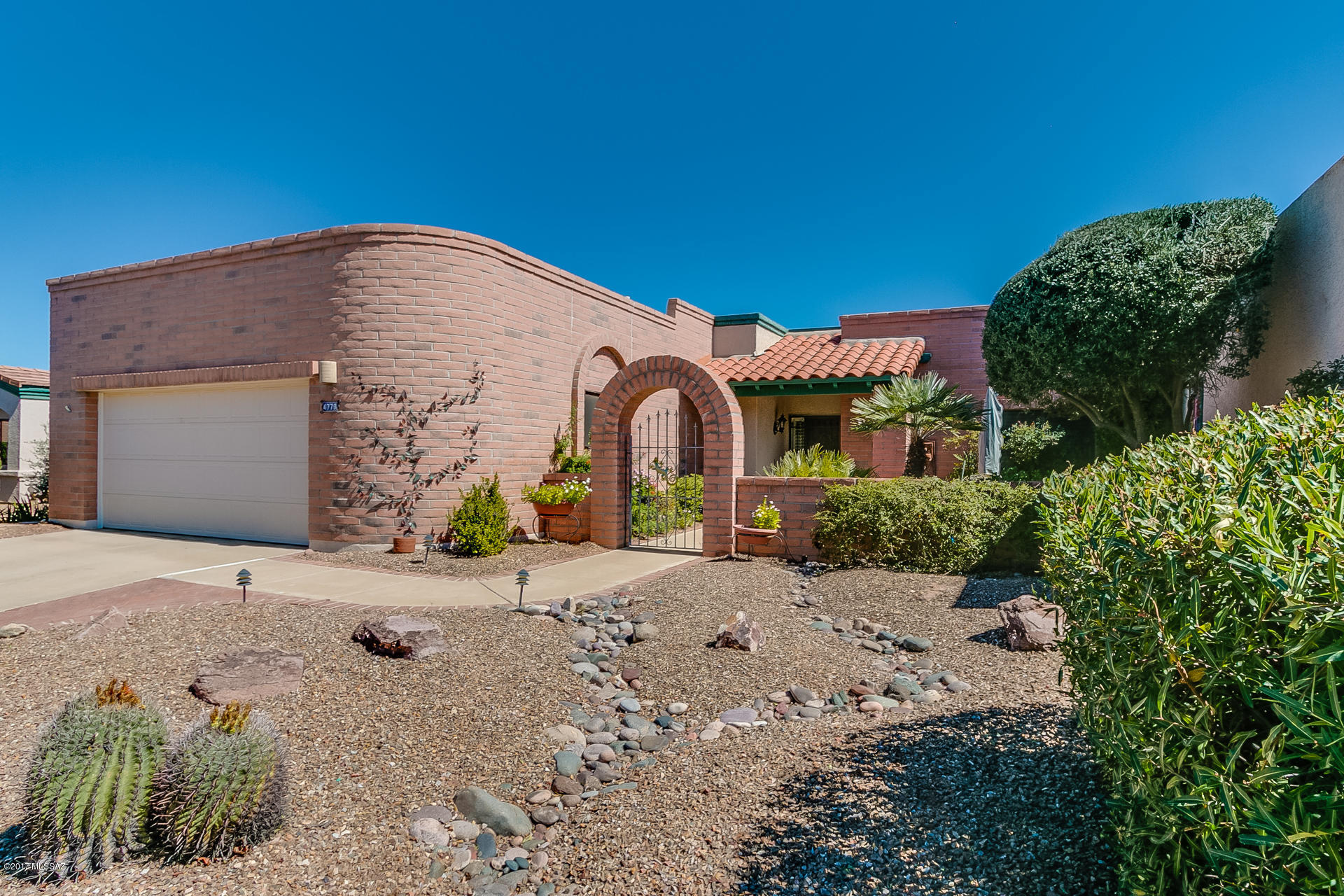 Outstanding, Unobstructed Santa Rita Mountain Views! Enter this beautiful home via a welcoming courtyard with soothing water feature; once inside, you'll enjoy those great views while noting how well the owners have meticulously cared for this 2BR + spacious den/2BA/Two Car Garage/1923 Sq' home. The functional kitchen has granite counters and a handy desk, plus it abuts a breakfast nook big enough to double as a hobby room. The spacious MBR Suite features plantation shutters, and the Guest BR Suite has a pocket door: complete privacy for Guests! There's tile in the traffic areas/well maintained carpet in the living areas, and the inviting, low maintenance patio has a water feature and shade tree for peace, serenity - AND VIEWS! Priced well, this excellent property won't last long!