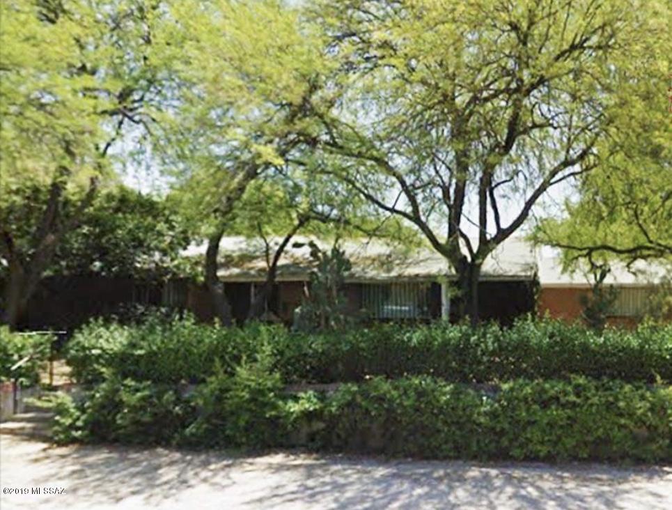 FULLY remodeled  4 bed, 3 bathroom with two Master suites in central Tucson! You'll love the spacious backyard with abundant citrus trees, 2 car garage and Master suite complete with its own fireplace and plentiful closet space. This home won't last!