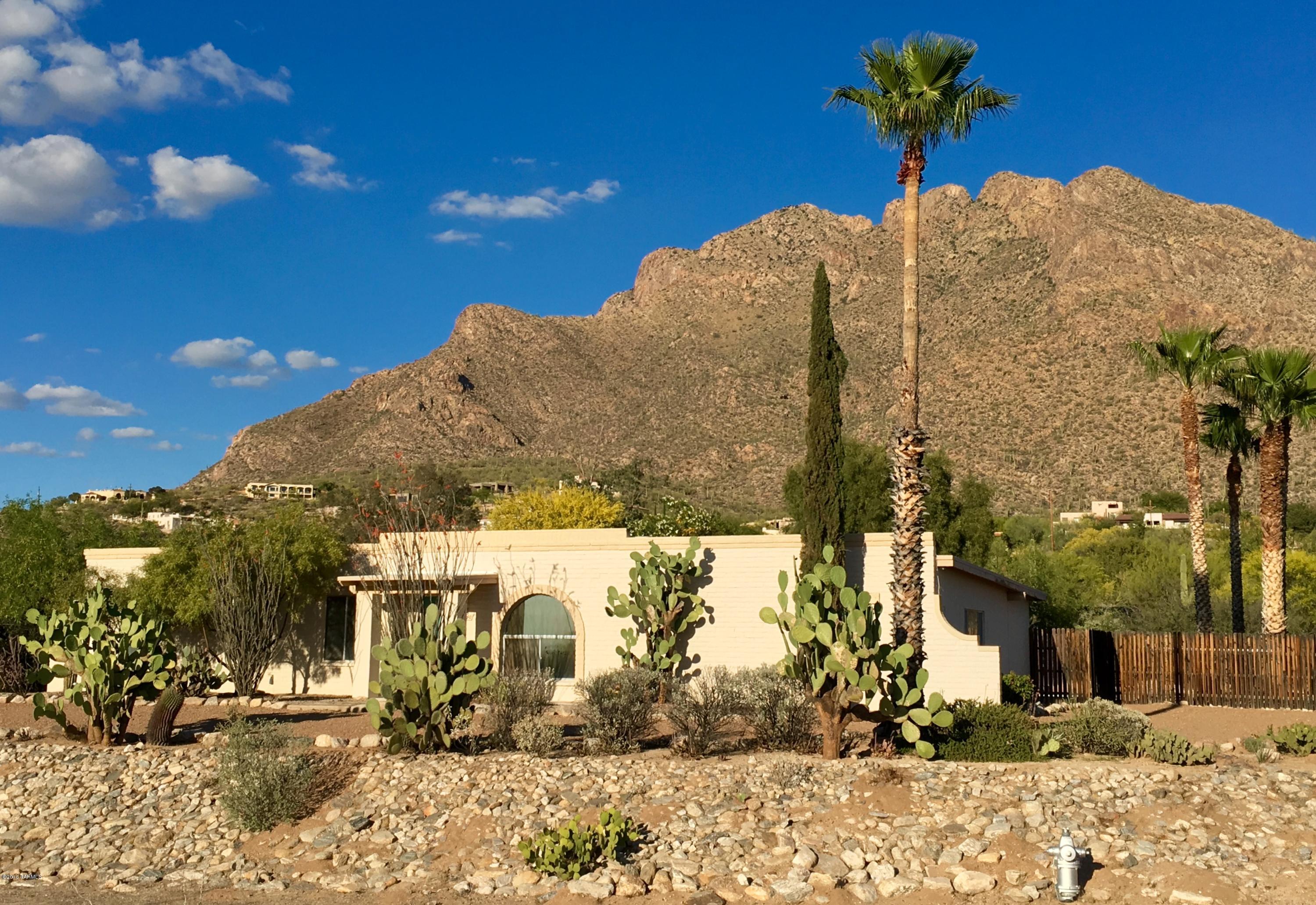 Stunning mountain views from this updated and remodeled home. Open floor plan leads to a private East backing yard with pool, views and covered patio. Enjoy the oversized family room with fire place, extra large laundry utility room and hobby room, newer  deep 2.5 car garage/shop/studio and RV parking allowed. Updated kitchen and bathrooms add to a turn key ready home.
