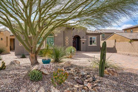 Impeccable Oro Valley home in gated community has been upgraded throughout! Premium VIEW lot takes in the Catalina Mountains from the back yard as well as through the extended width double glass doors off great room. Kitchen features SS appliances, dual fuel range with gas cooktop and double electric ovens, granite counters, breakfast bar, stacked cabinets, pantry closet. Formal dining room off kitchen.  Large primary suite with mountain view, soaking tub, separate shower, double vanity, walk-in closet. Guest bedroom has Murphy bed and ample closet space. Den/office features double glass doors, built-ins. Amazing low-care professional landscape front and back. Full house SOLAR owned. Power shades at west and south sides of patio for maximum comfort. 50-amp service for RV at the property for short-term stays. Did I mention the mountain views?!? This is a must-see home. The home is next to walking trails of Visto Trails Nature Preserve. The clubhouse is within walking distance with a playground, spa, real grass areas, firepits, and rotundas for your gatherings.