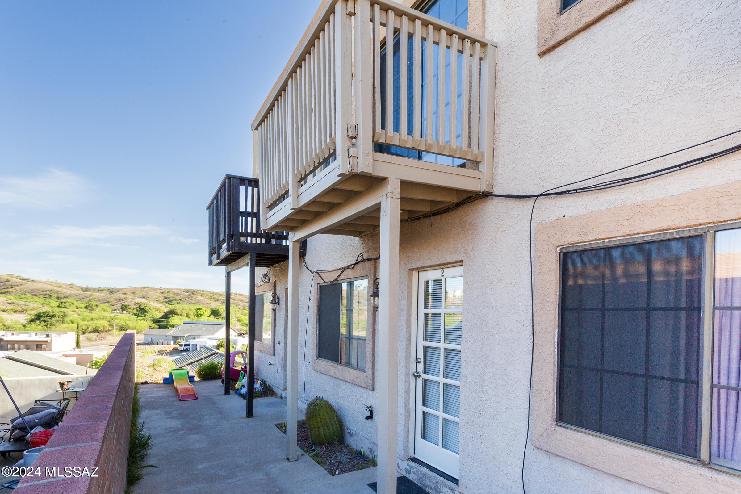 MOVE-IN READY RENTAL! This well-maintained & spacious 2 story, townhouse-style apt (Unit #2) is ready for new tenants! Features include A/C, beautiful Saltillo tile flooring downstairs, & cozy carpet upstairs. Enjoy an enclosed upper balcony with scenic views, a private back patio, & the convenience of an in-unit washer & dryer, dishwasher, stove/oven & New refrigerator. Covered parking spot. Ideally located in a desirable area close to shopping, dining, & everyday essentials. Don't miss this great opportunity—schedule a viewing today!