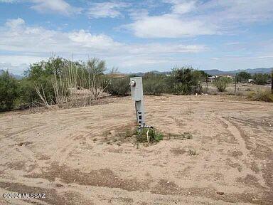 Nestled amidst serene natural beauty, this vacant land offers an extraordinary opportunity to create your dream retreat. Spanning 1 acre, this property boasts unobstructed mountain views that provide a stunning backdrop for any vision. The expansive lot features a flat terrain ideal for custom home construction, equestrian facilities, or recreational use. Surrounded by lush desert vegetation, the land promises privacy and tranquility. Don't miss out on this vacant land! This Lot has all the utilities available, Water, Electric & Septic hurry before this deal is gone!! Seller will consider Owner Carry with $18k down.
