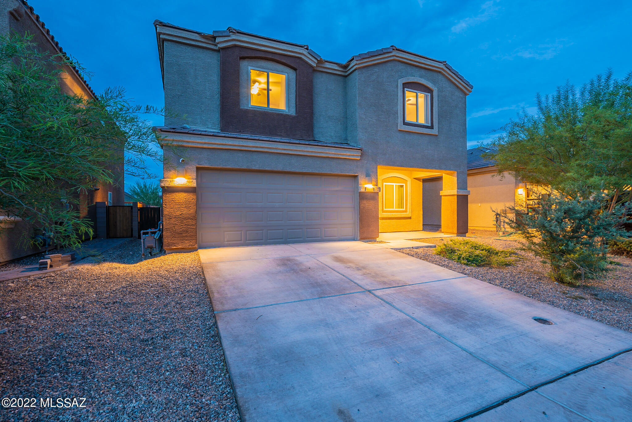 Beautiful 2-story move-in ready home in the desired Vail school district.  This 5 bedroom, 3 bathroom home offers an open floor plan with a large island/breakfast bar, granite countertops and stainless steel appliances. Downstairs you'll find a guest bedroom with full bathroom, and upgraded wood plank tile. Upstairs is a spacious loft, laundry room, and master suite with garden tub and walk-in closet. Duel vanities in both bathrooms with plenty of counter space. The back yard offers a covered patio, outdoor kitchen with a natural gas line, and refrigerator. A beautiful pebble tec pool with heater and in floor cleaning with custom paver work on one of the largest lots in the community.  This home also offers a 2 car garage, water softener system, and solar panels.