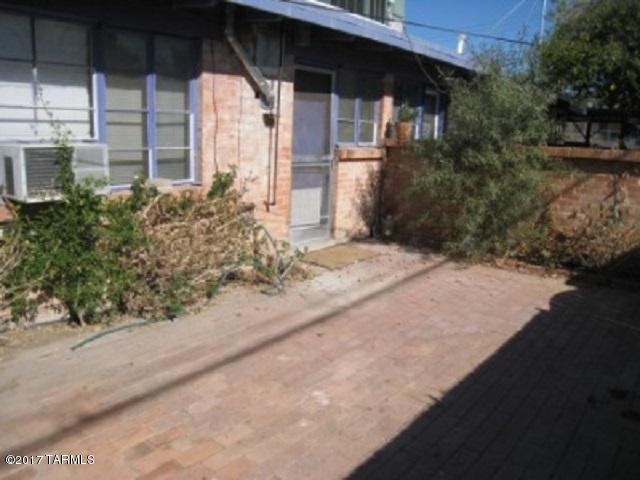 * ONE MONTH FREE W/18 MONTH SIGNED LEASE*   This unit is quaint and spacious with a cement yard for easy care maintenance. This unit has wood beam ceilings, cement floorings, built in cabinets, and plenty of storage space. Take advantage of restaurants nearby, Reid park, and great biking opportunities to nearby shops. The refrigerator and water is included with this property. This home can be rented for 12 months or longer.