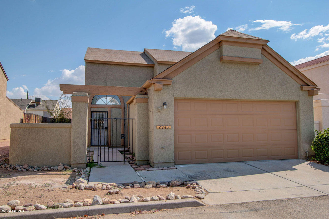 Adorable 2 story Star Trails Estates home in NW Tucson. 2016 updates include exterior paint, interior paint, tile/grout cleaning, carpet replacement, interior garage painted. This split floor plan features a downstairs tiled master bedroom with 3/4 bath & walk in closet, a downstairs powder room and 2 upstairs bedrooms with a full bath. The 2 car garage has covered entry to the kitchen through a tiled mud room off an additional attached storage room. Covered patio and fenced back yard. RV/boat/trailer storage available within the community.Two community pools