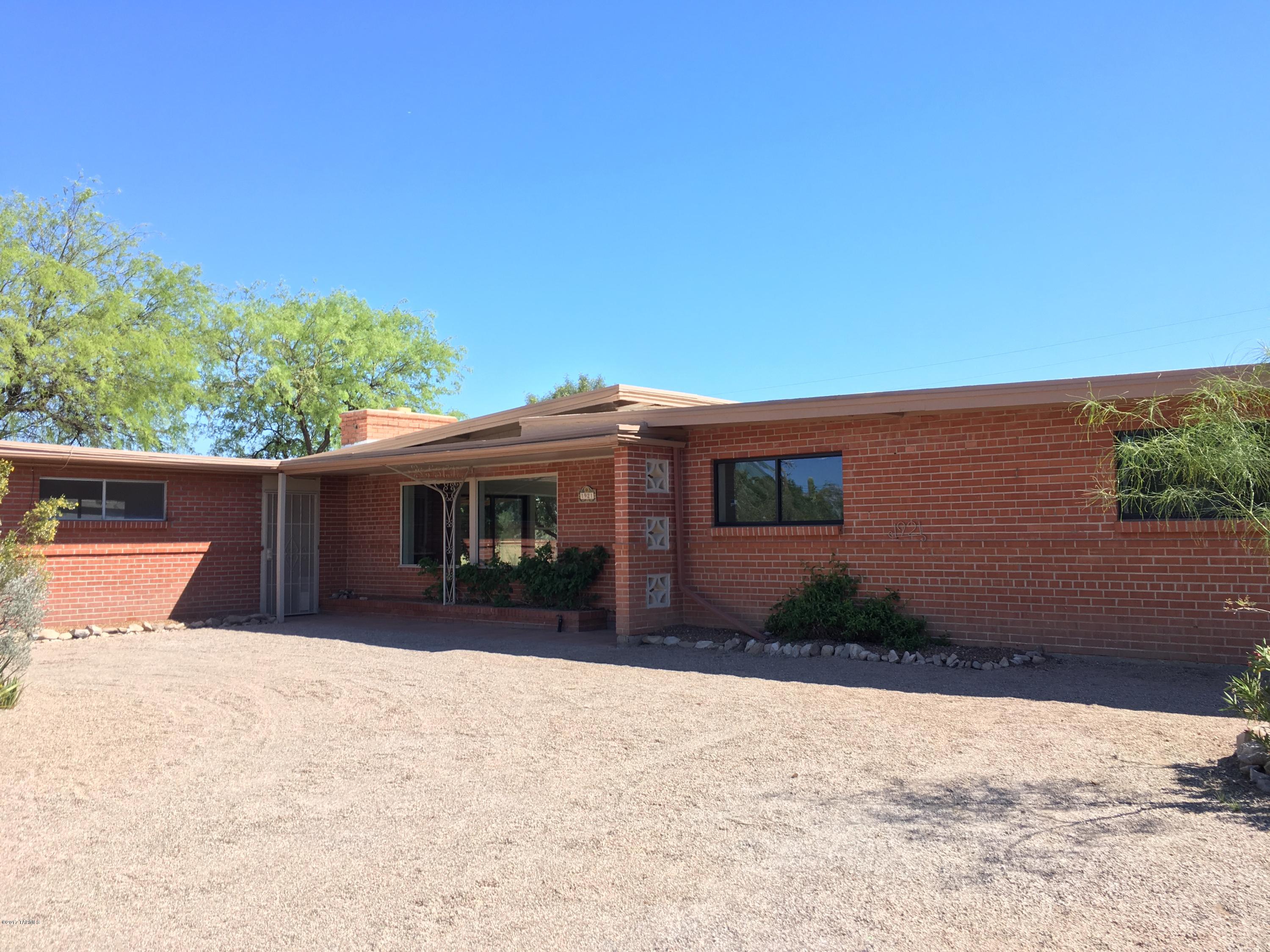 Come see this beautifully remodeled brick home on one of the largest lots in this subdivision. This home boasts of modern features with stainless steel appliances in kitchen, cozy fireplace in living room, ceramic tile throughout and remodeled tile showers in both bathrooms. There is a studio room with separate entrance which could be used as guest or mother-in-law quarters or whatever fits your needs!  Backyard has unobstructed views, a large covered porch, and an open patio with hot tub/spa conveniently located off family room. Finishing touches in progress.  Come see today!