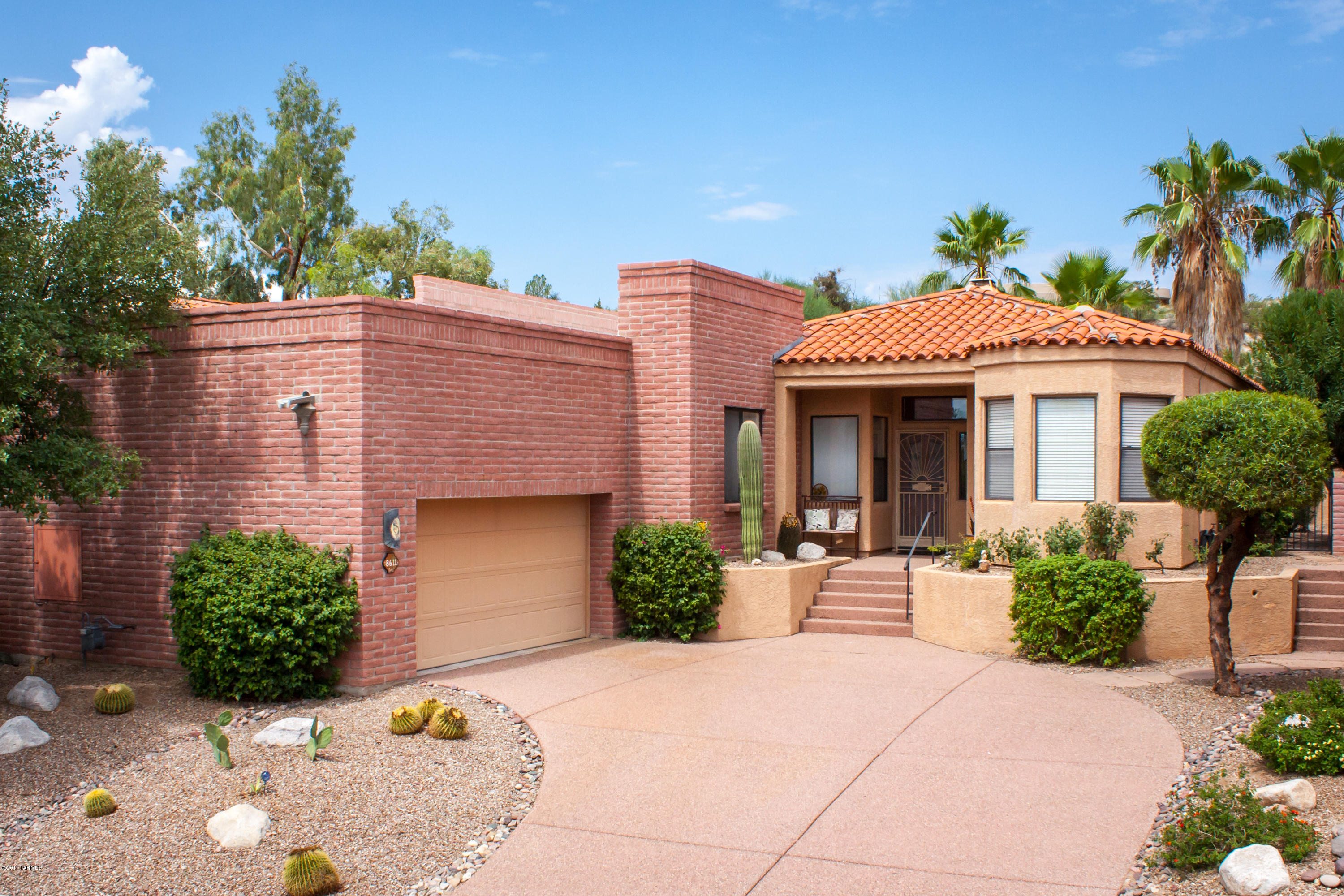 Located in gated Omni Tucson National in desirable Fairway Heights this single family home backs to the 2nd fairway of the Sonoran course. Tastefully renovated to provide a great room concept. New soft close cabinetry, slab granite, SS GE Profile appliances, under cabinet lighting & Catalina views from the dining alcove. New recessed lighting throughout. Master suite offers engineered wood floors & Travertine in the bath. New shell shower, cabinetry, slab granite w/roomy walk in closet. Guest bath offers double decorative sinks, tile tops. 3rd bedroom/office features a Murphy bed w/ desk & storage closets, wood floors. Great room w/fireplace & soaring ceilings,sliders to the private pavered covered patio & trickling fountain. HVAC 2009, H2O htr with recirc pump 2015, Poly replaced 2015