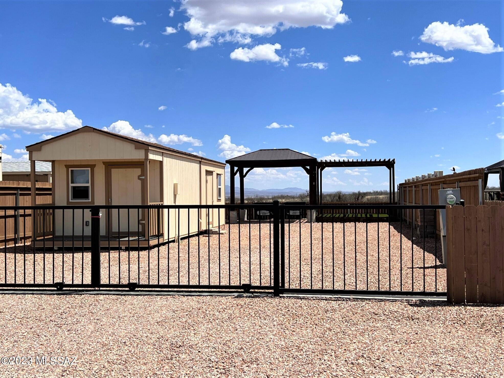 Premium 40'x 100' view lot located in the gated Arizona Legends RV Resort a 55+ senior community with views of the San Pedro River Valley and surrounding mountain ranges. The lot features a 10'x 14' Casita with carpet, tile, electric, washer/dryer hookup and a 6 gallon water heater plus an additional 10' x 14' unfinished workshop/storage shed. You can enjoy the views from the outdoor 10' x'14' Pavilion & 10' x 12' covered deck. The lot is surrounded by a solid cedar fence and a steel sliding entry gate. The community amenities include a Club House, banquet room, library, pool table, exercise room, pool, spa, patio area, laundry, restrooms and walking paths.